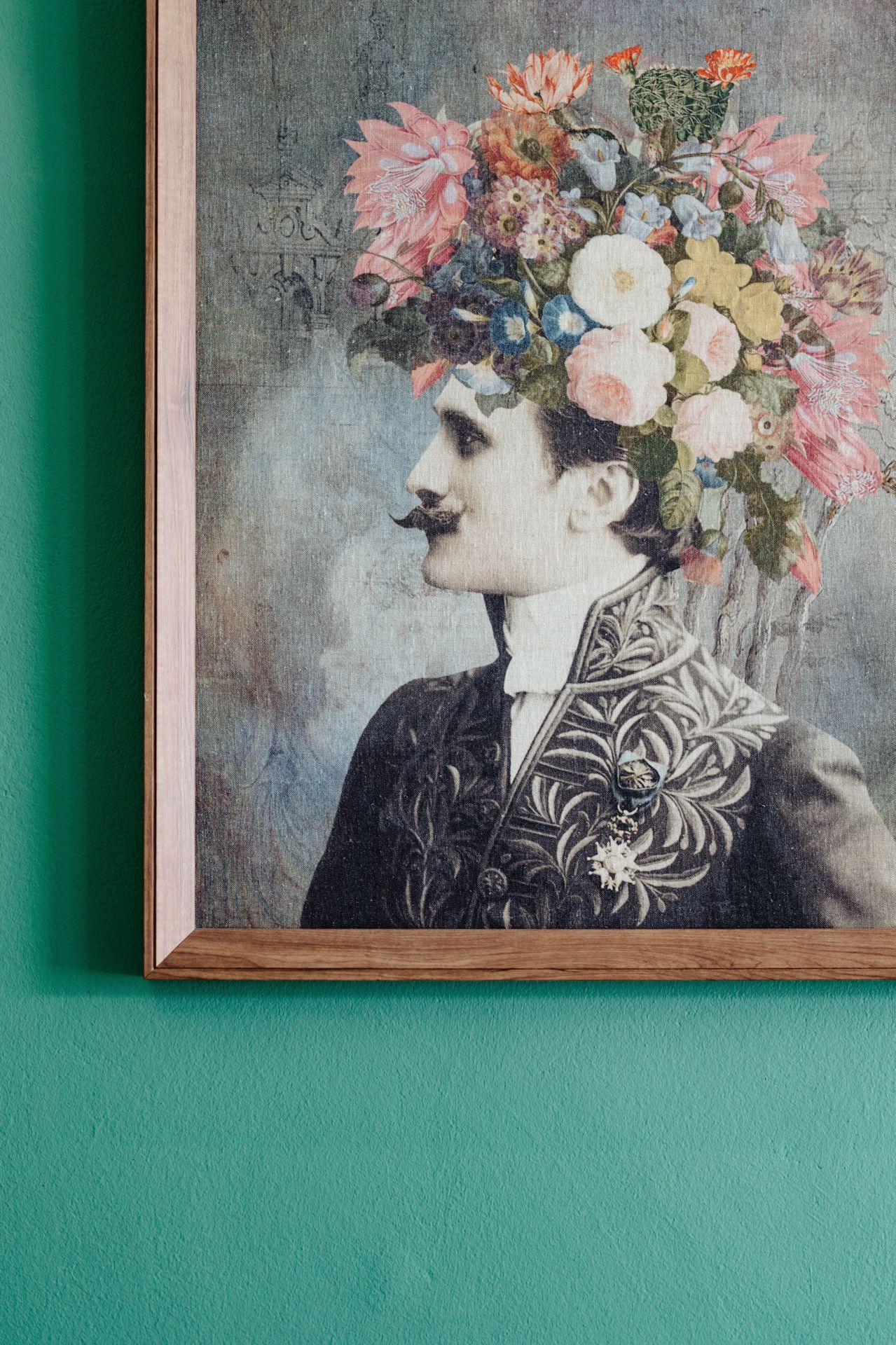 Artistic photograph series showing profile portraits with floral headpieces mounted on turquoise wall.