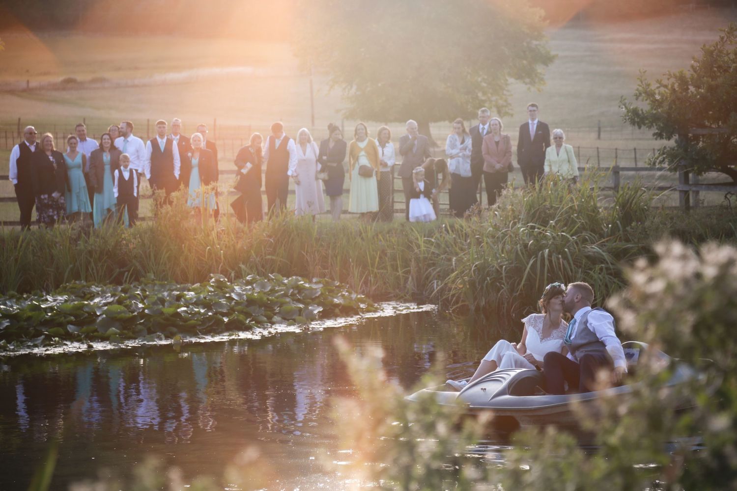 Newlyweds on a pedlo, unique wedding photography by Ruby Salmon Photography