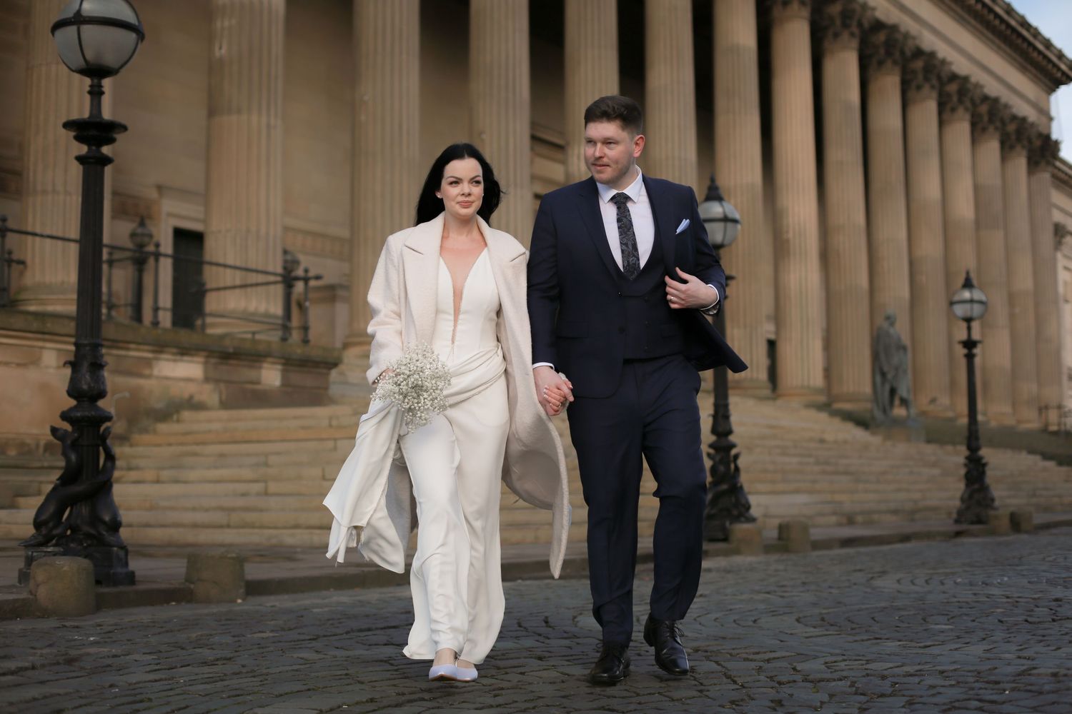 Newlyweds walking outside St. George's Hall, Liverpool wedding photographer, Ruby Salmon Photography.