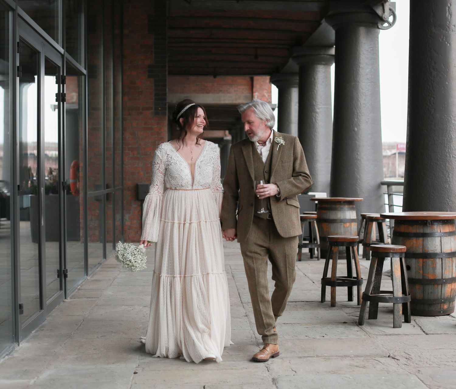 Bridal couple walking outside The Titanic Hotel, Liverpool wedding photographer, Ruby Salmon Photography