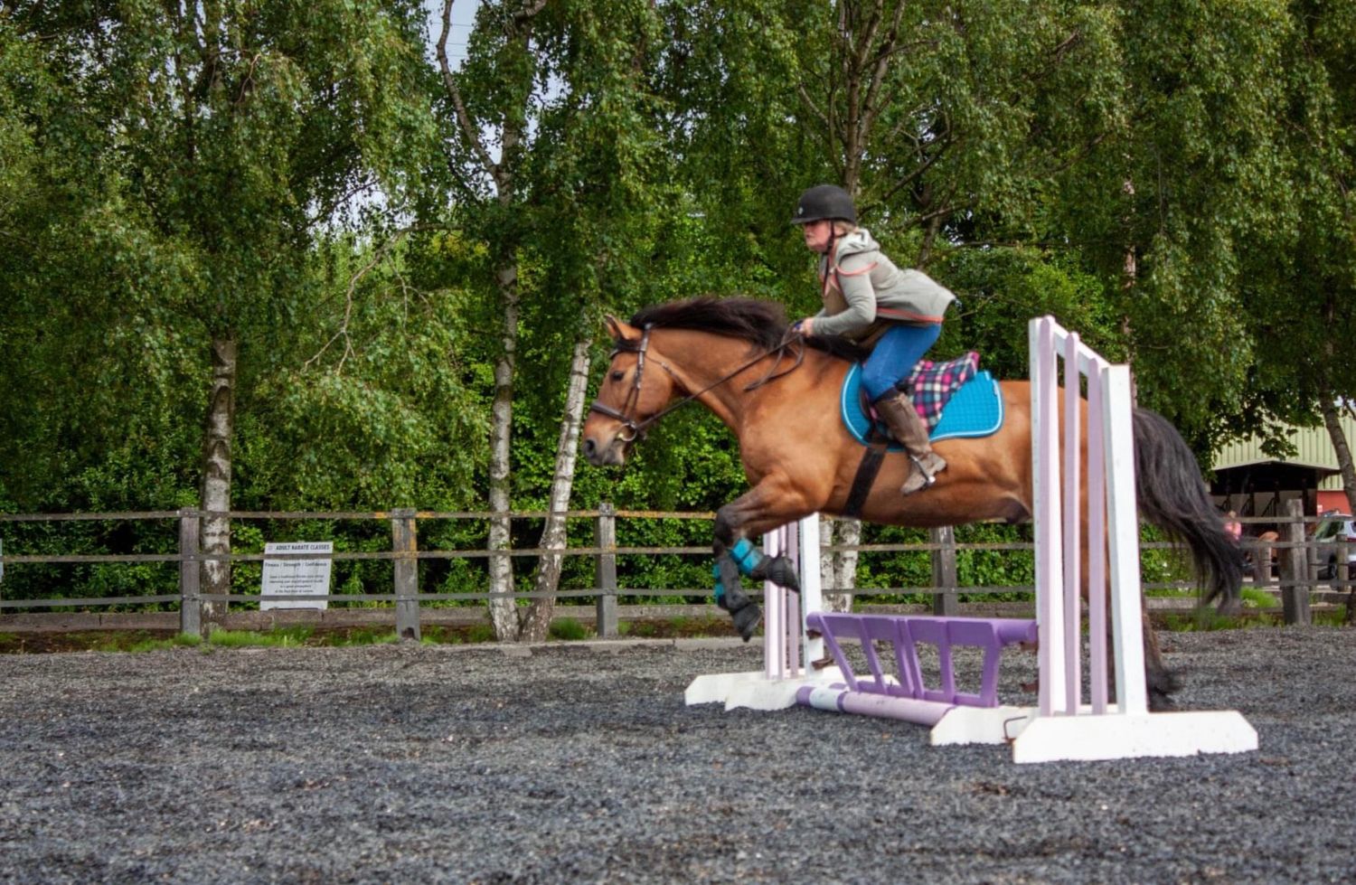 Cally and her pony Charley jumping.