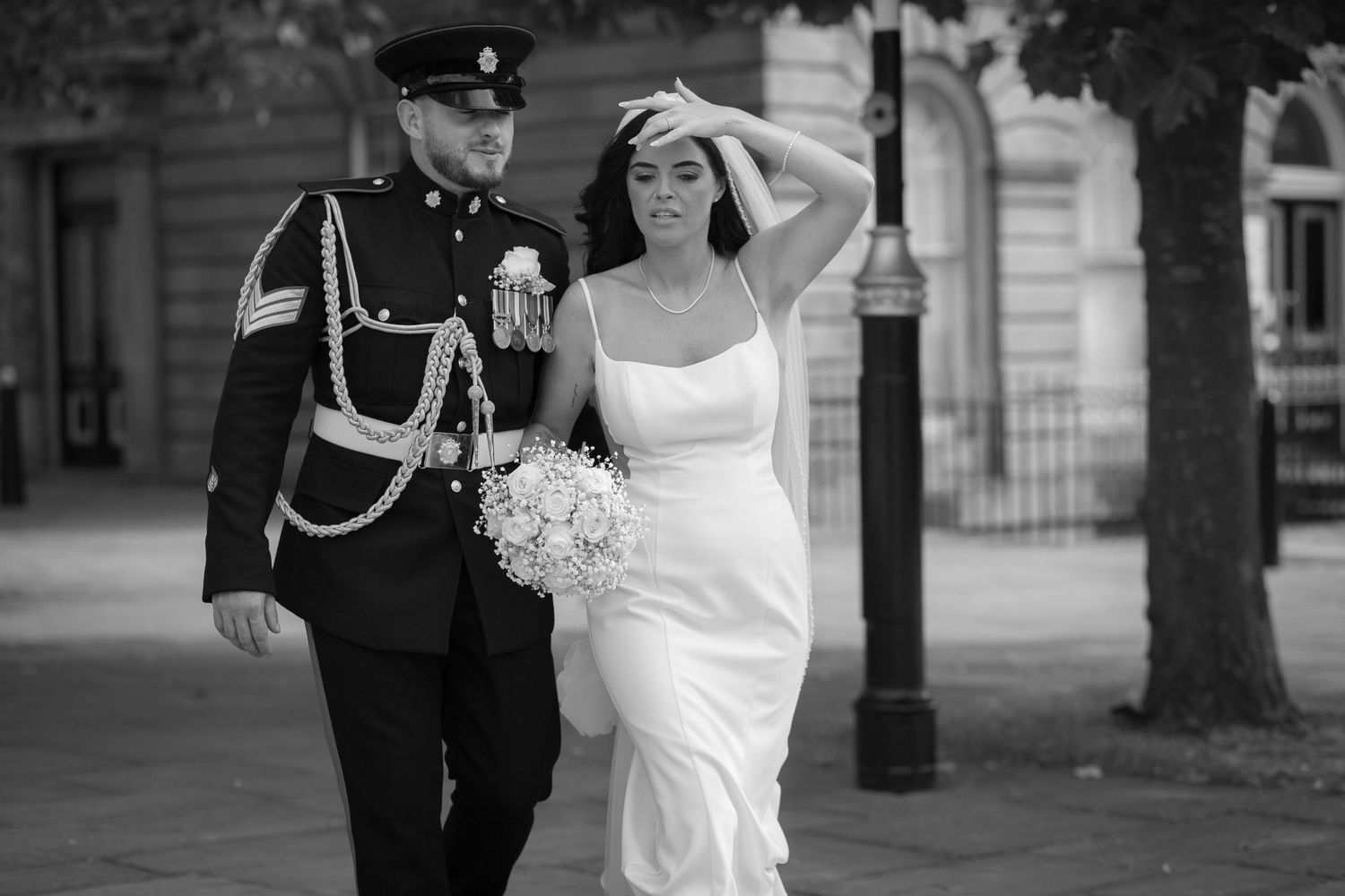 Newlyweds walking through Hamilton Square, Birkenhead. Wirral wedding photographer Ruby Salmon Photography.