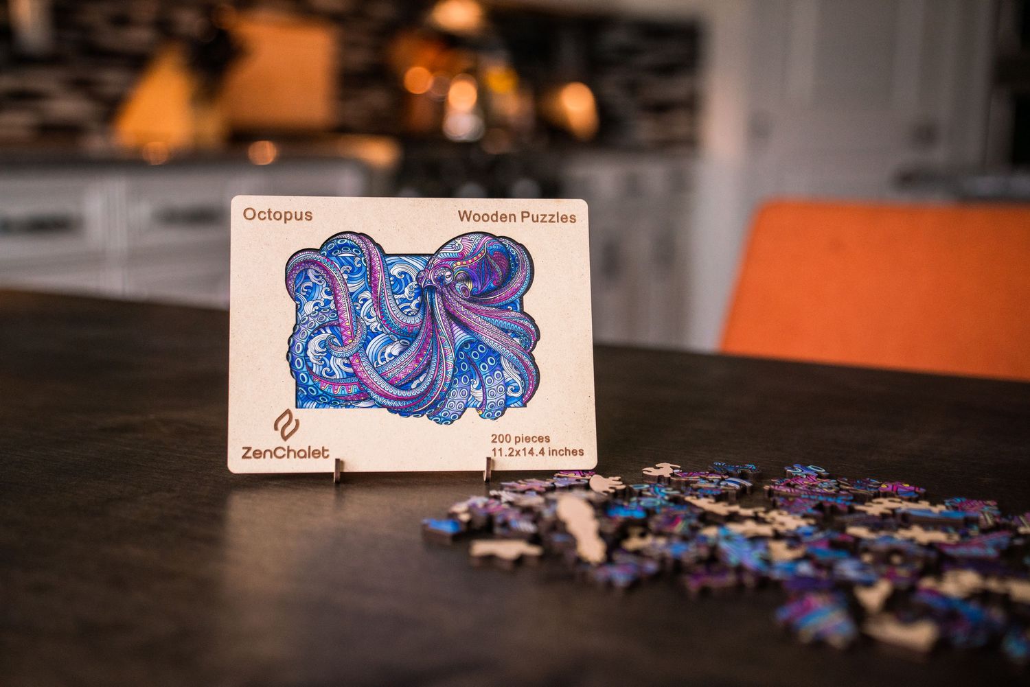 ZenChalet octopus wooden jigsaw puzzle displayed on a stand next to loose pieces on a table.
