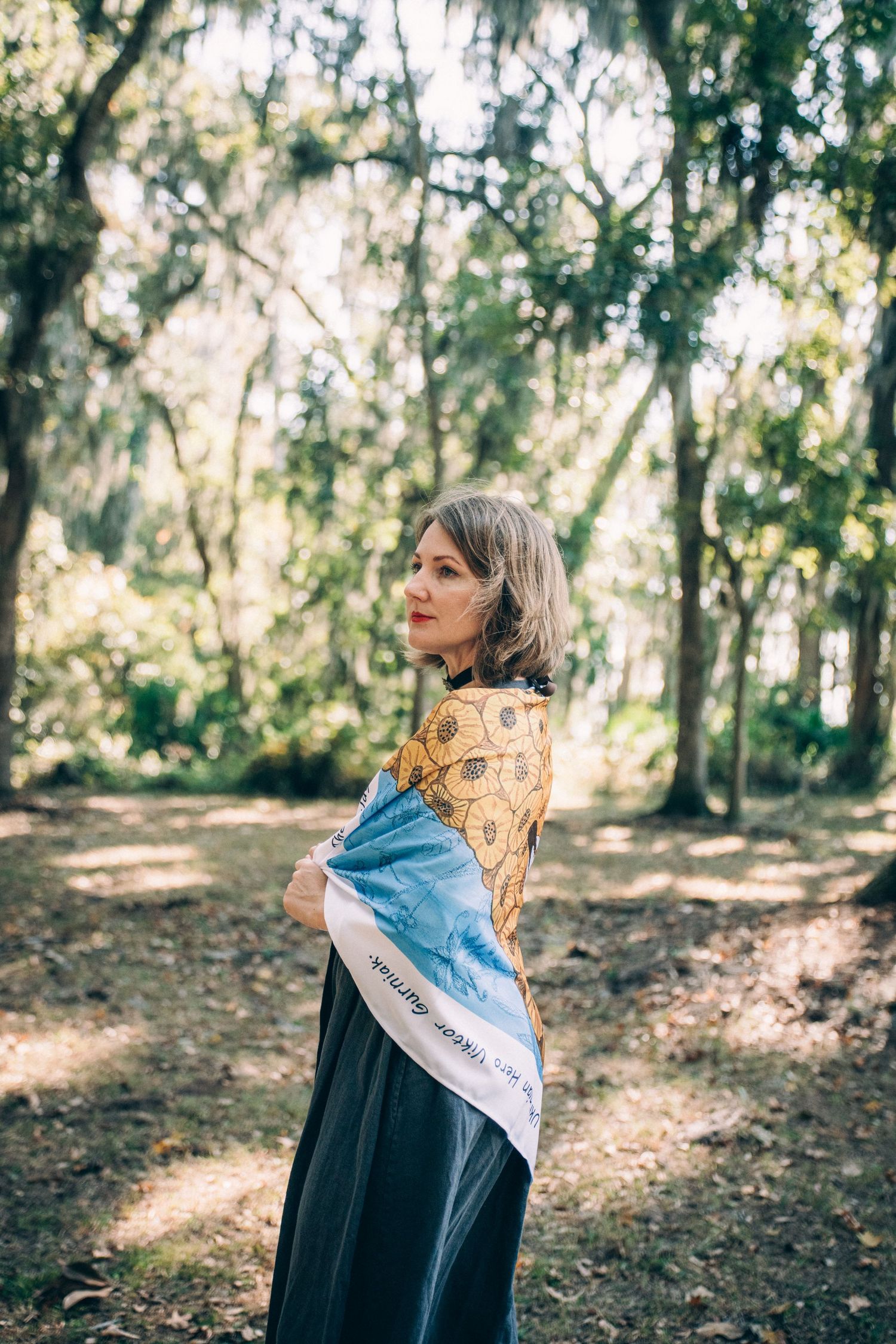 A series of outdoor portraits in a sunlit forest with trees and dappled light creating a dreamy atmosphere.
