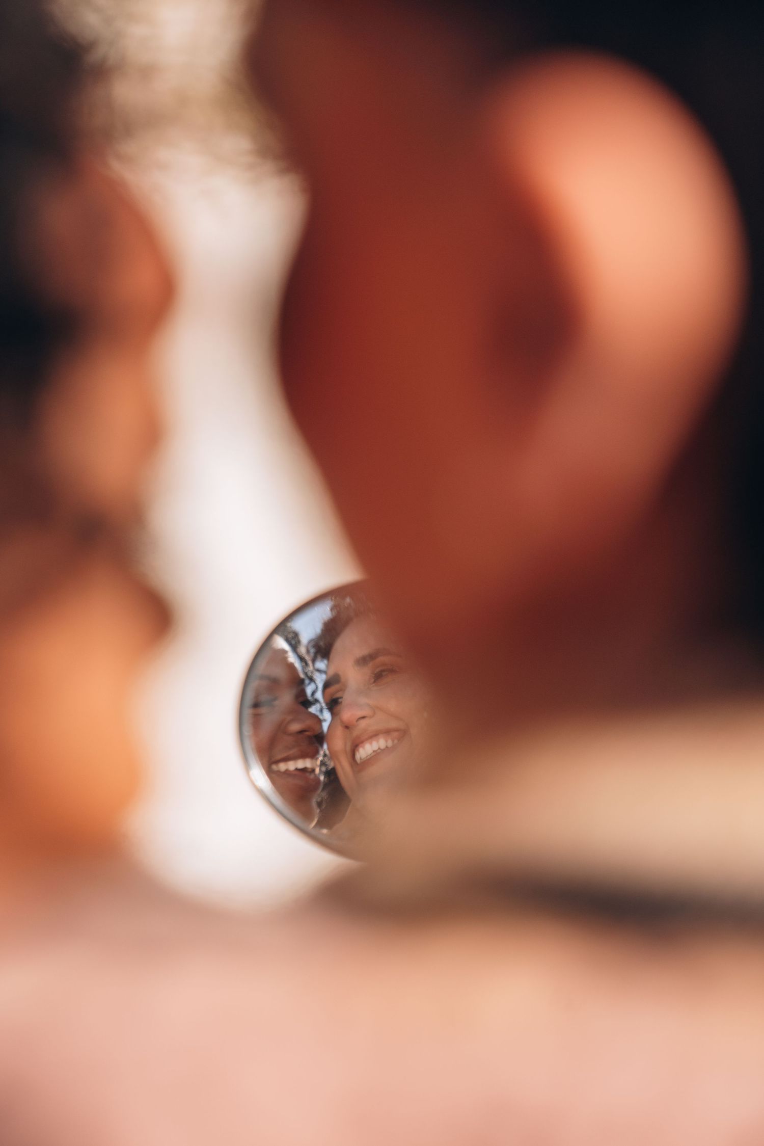 Close-up macro shots of engagement rings with bokeh effect in warm tones.