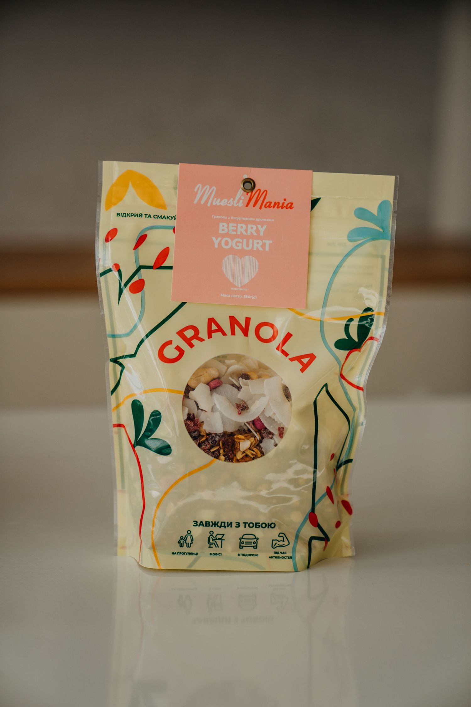 MuesliMania Berry Yogurt Granola bag on a white surface.