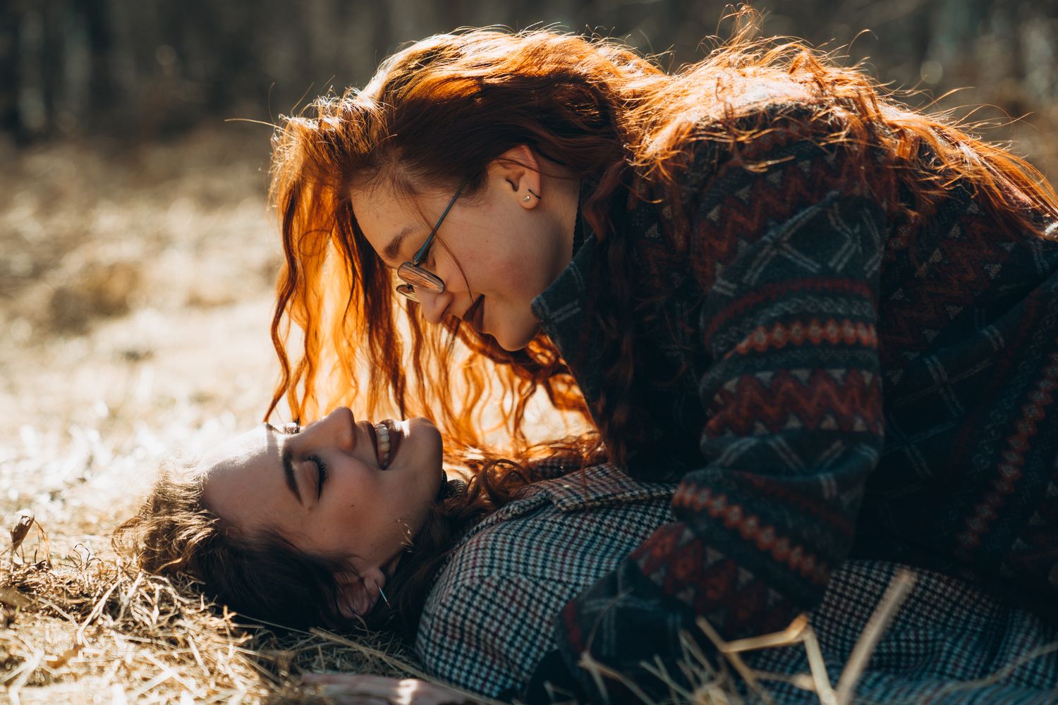 Couple sharing intimate moments in warm autumn sunlight.
