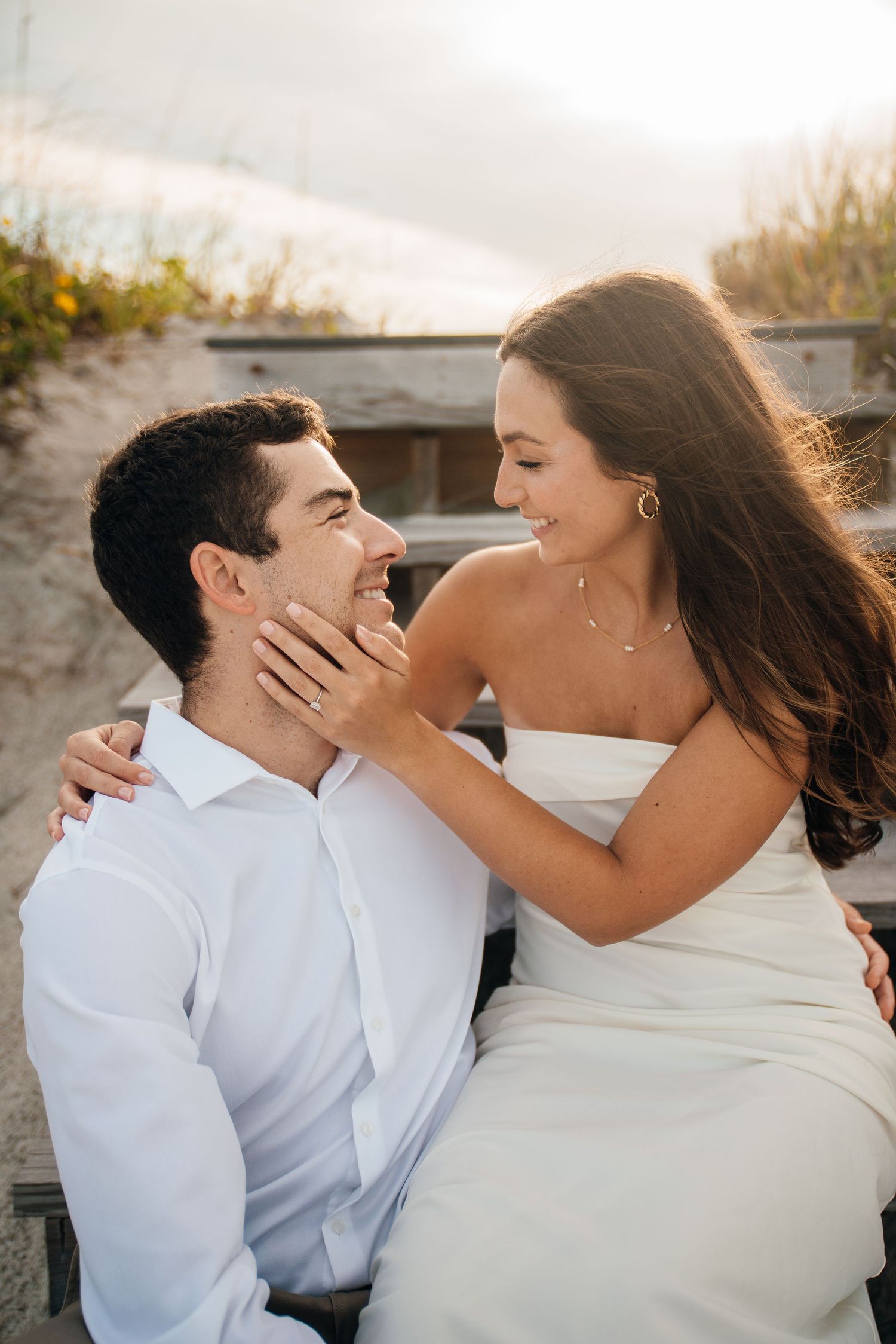 A series of tender moments captured between a couple on a beachside setting.