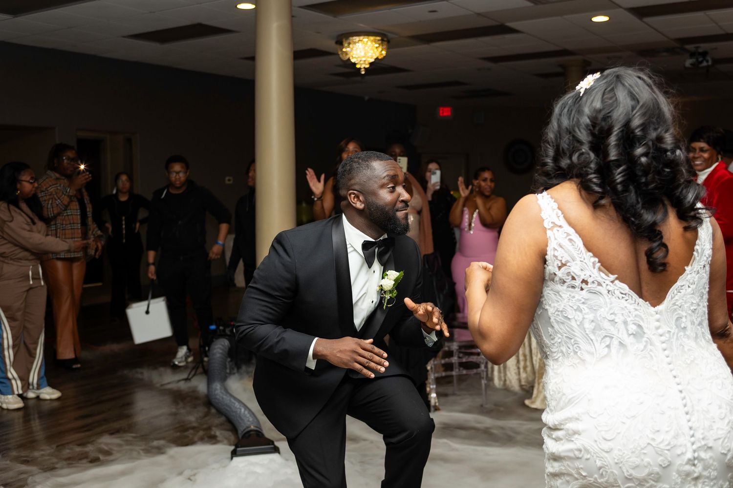 Wedding reception dance floor filled with celebration and festive lighting.