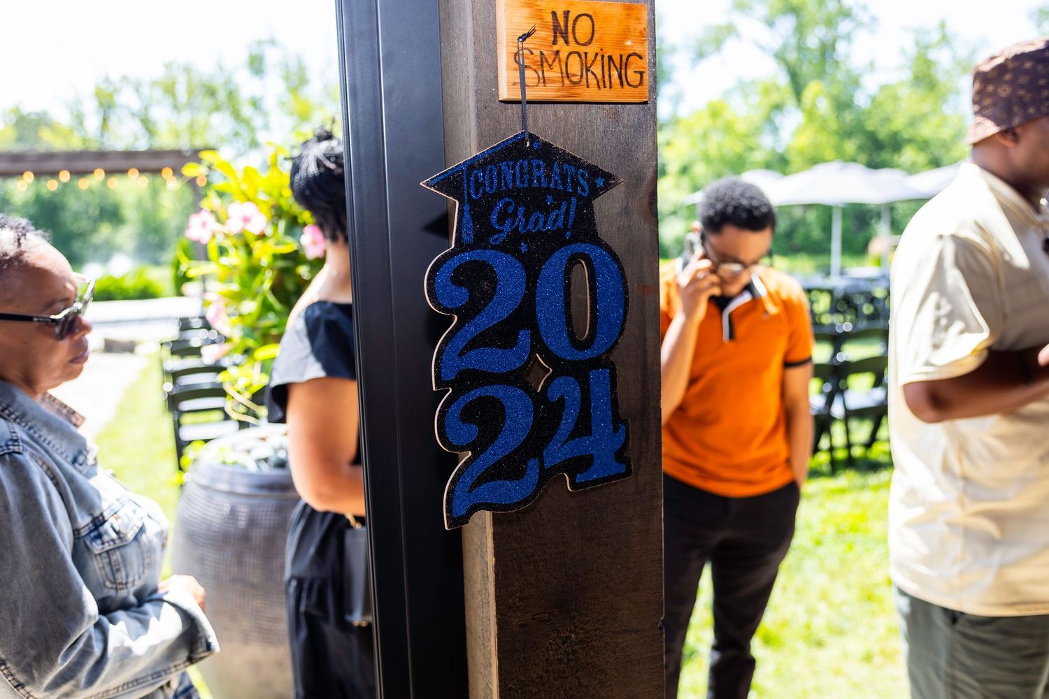 Outdoor event signage and decorations against a natural backdrop.