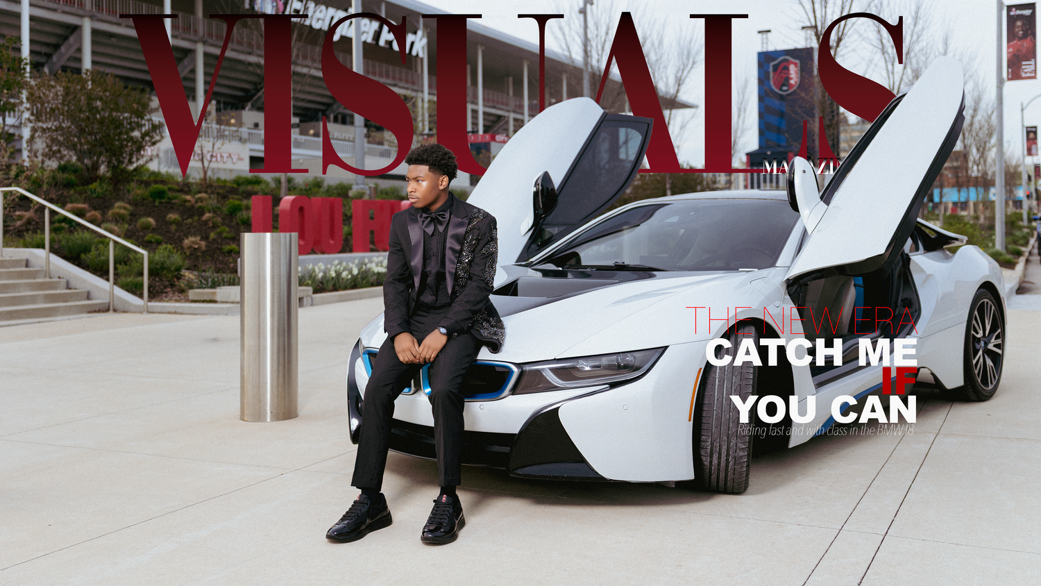 Man in black jacket poses beside a BMW i8 with scissor doors open near a Visuals sign, text reads Catch Me You Can.