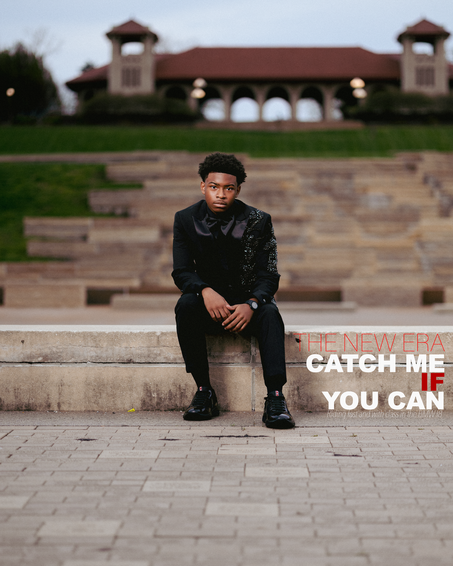 Young man in black outfit sits on steps outdoors, with text overlay reading The New Era Catch Me If You Can.