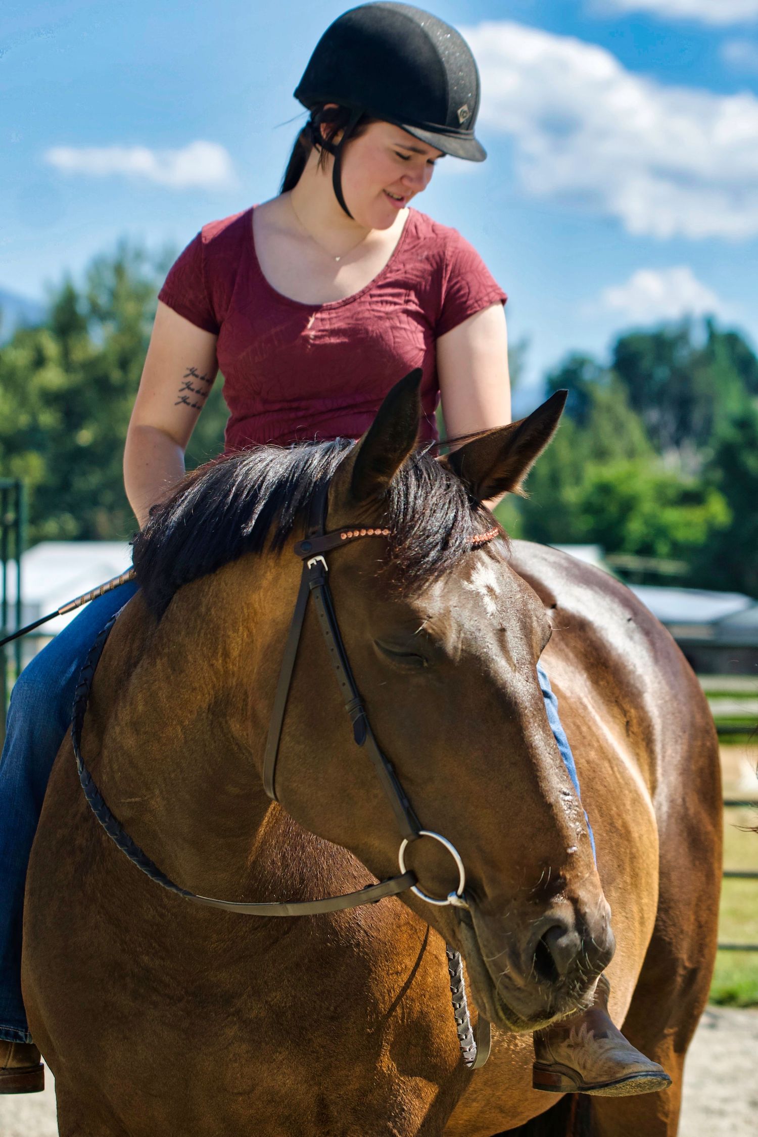 female on horse looking in the same direction as horse