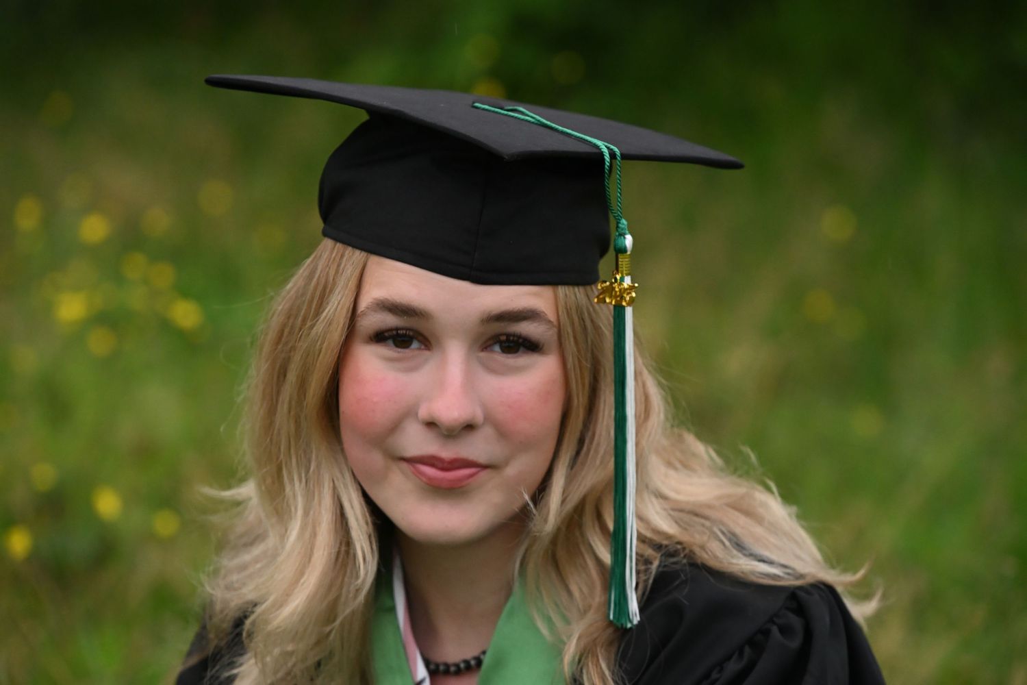 Female posing in graduation cap and gown. Close up Fraser Valley