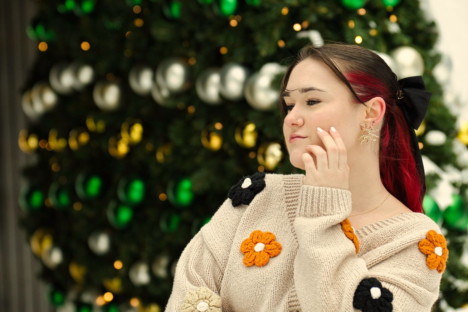 Female posing in front of large outdoor Christmas tree Chilliwack