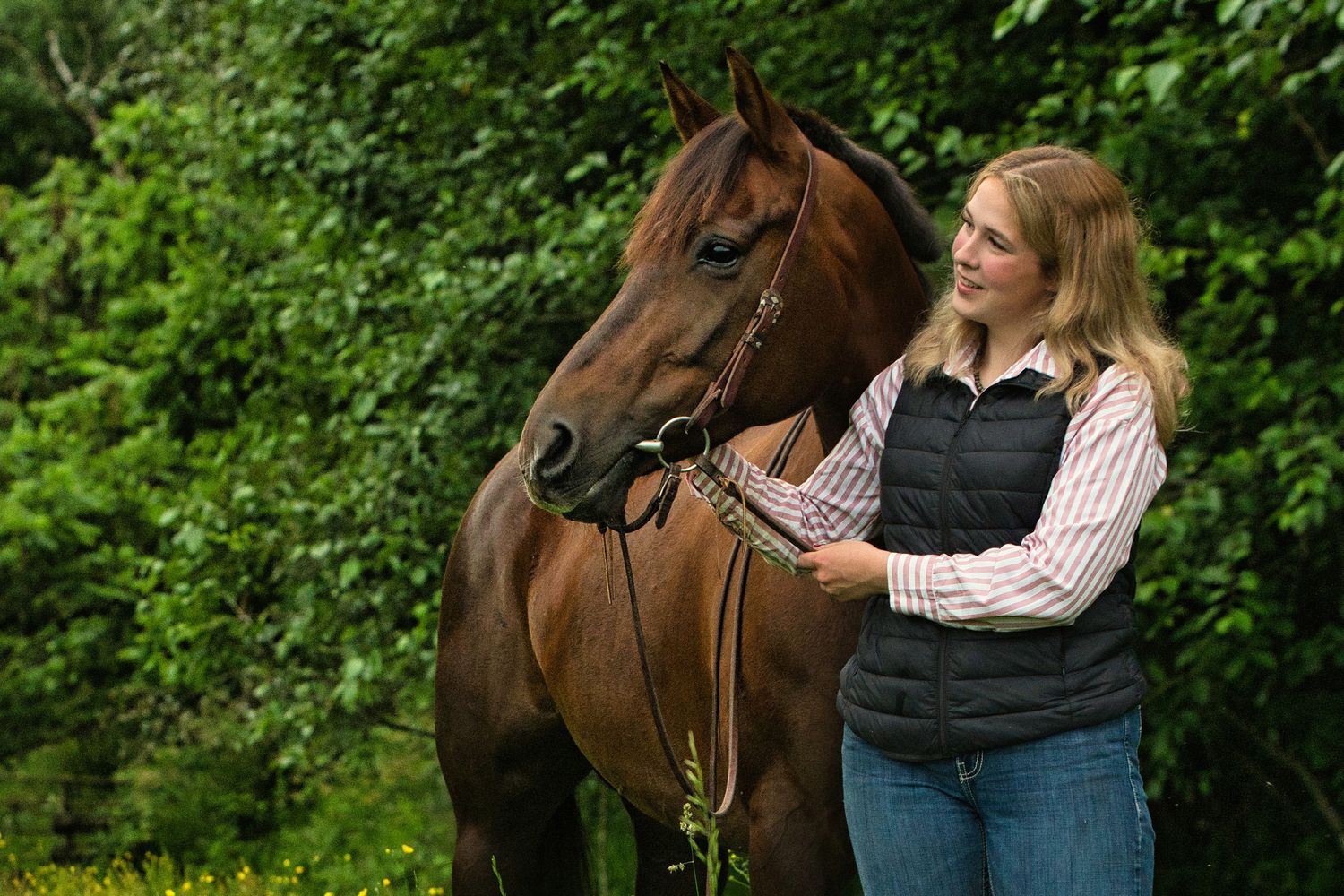 female on ground holding her horse and both are looking to the left, horse & rider, graduation, Fraser Valley