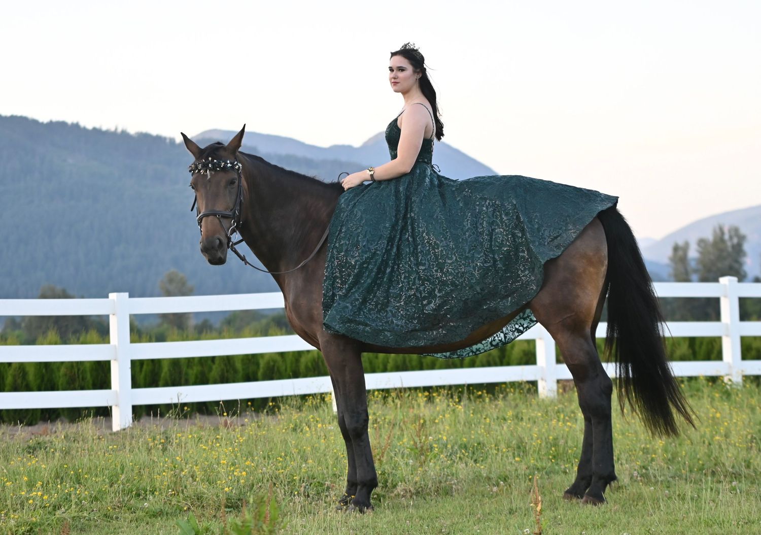 Female in green grad gown sitting on bay horse, equine, graduation, Fraser Valley