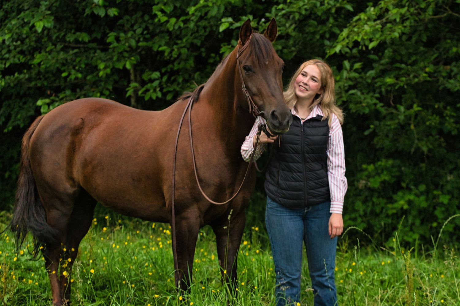 female looking lovingly at horse
