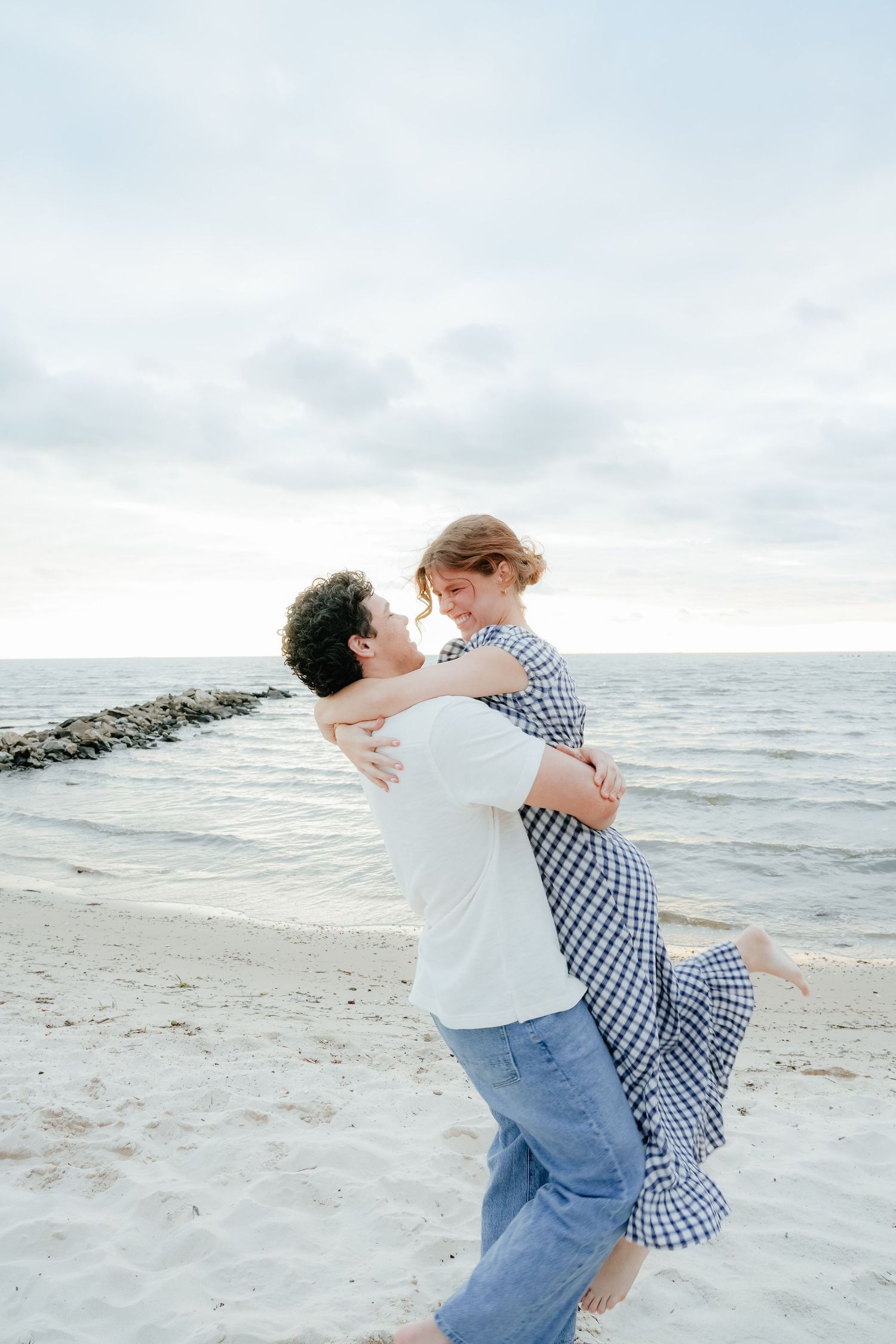 Engaged Couple Spinning on Louisiana Beach at Sunset