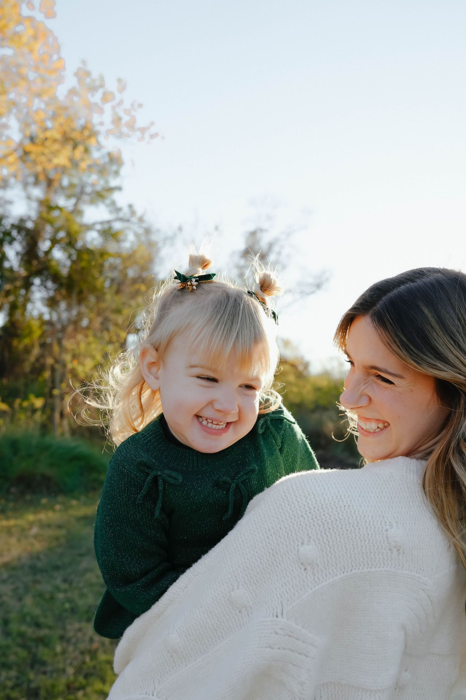 Mom Holding Daughter at Sunset in Louisiana