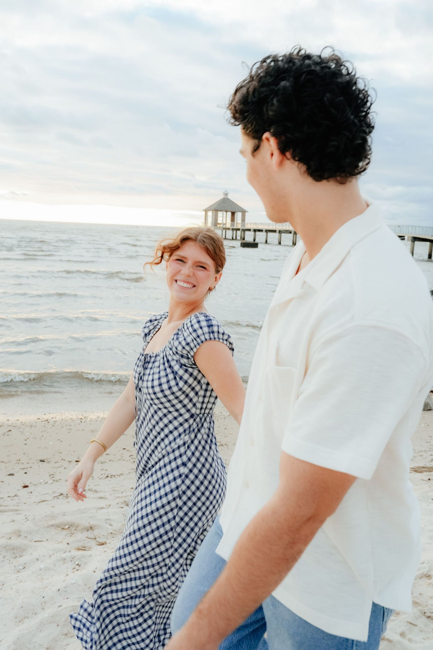Couple Walking and Smiling at Beach Sunset in Mandeville, Louisiana