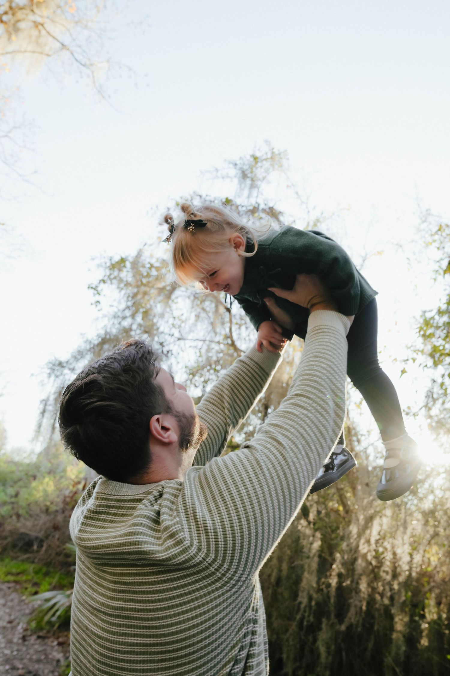 Dad Holding Daughter in Air at Sunset in Louisiana