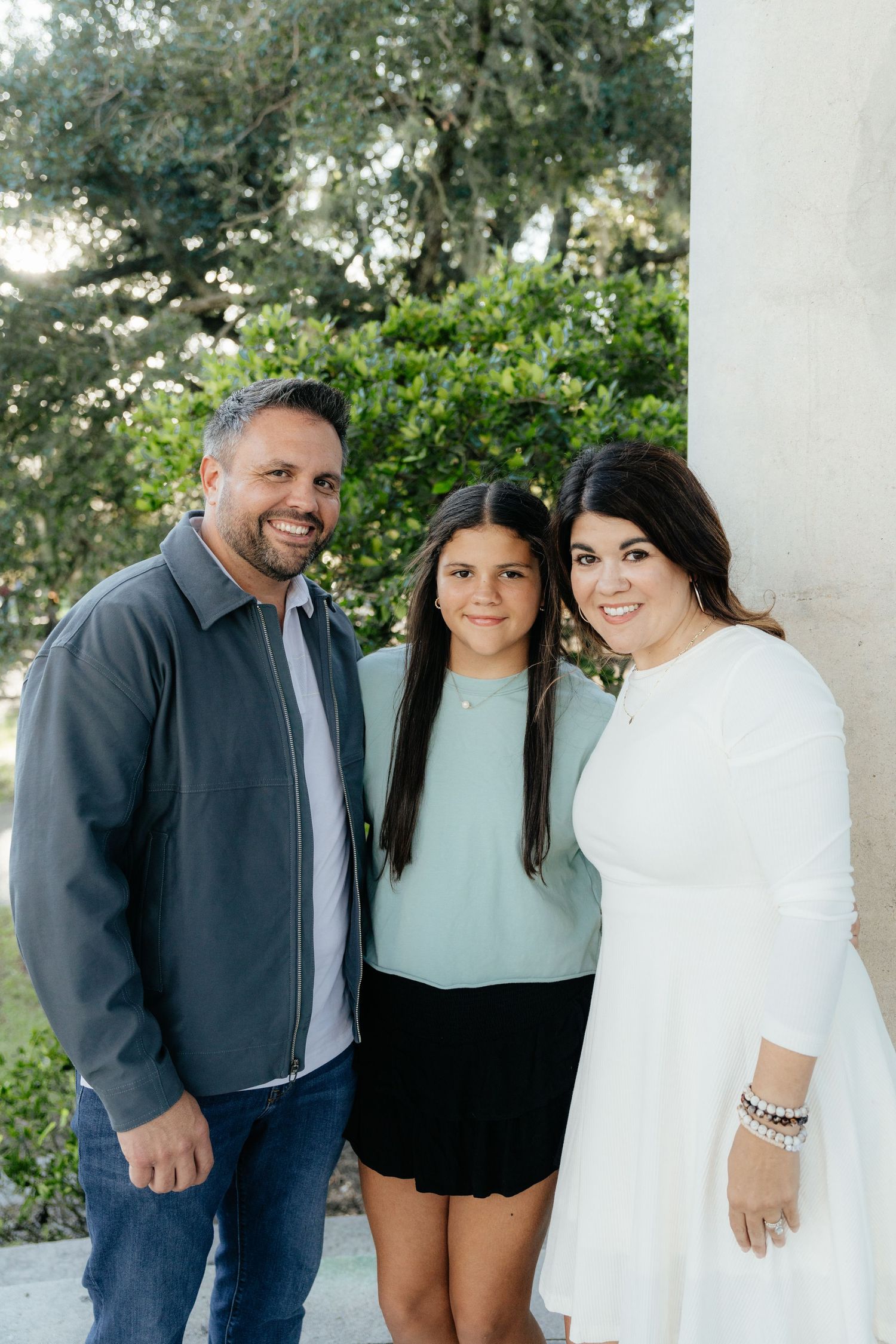 Parents and Daughter Smiling Together in Louisiana