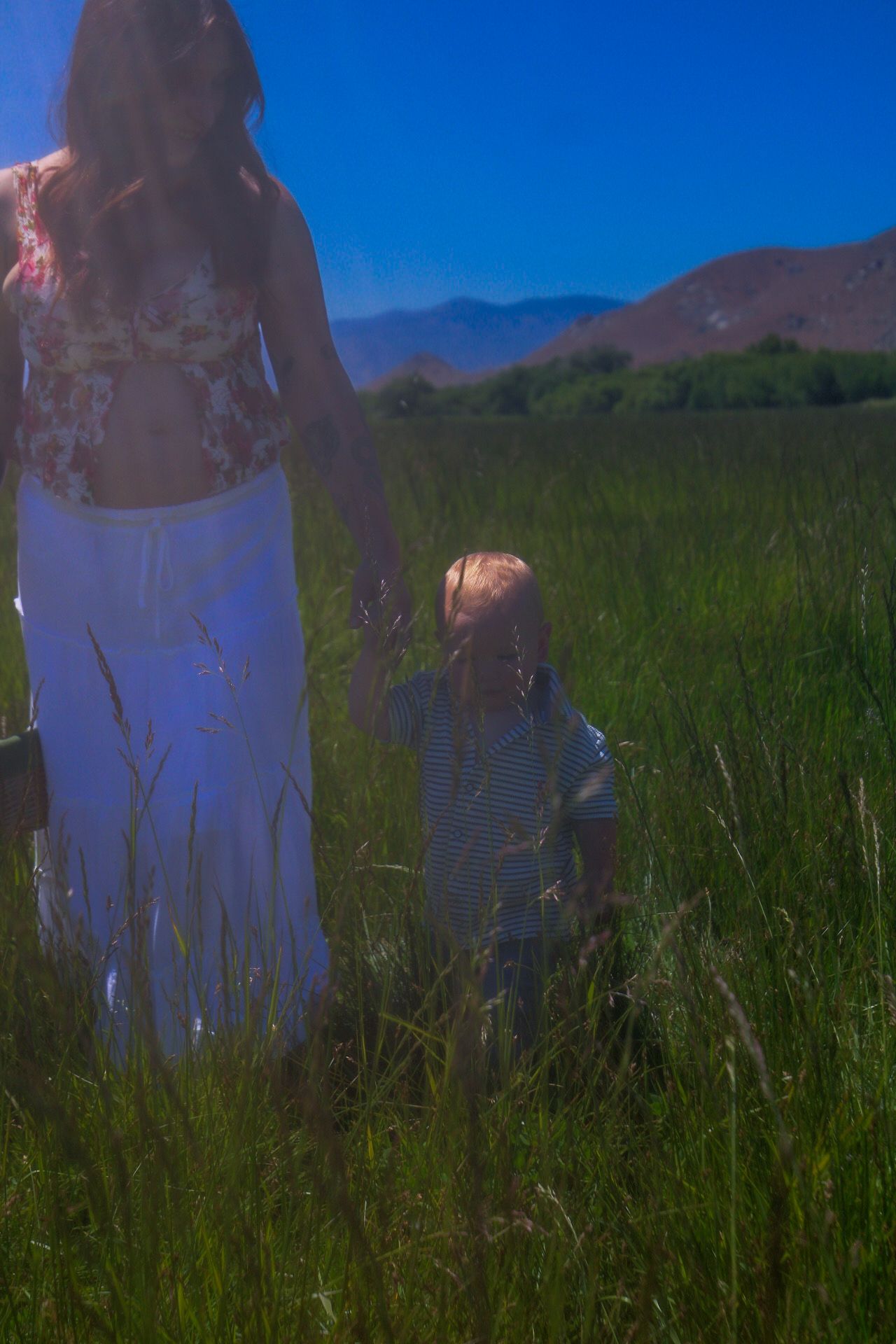 dreamy, cool mom holding sons hand
Kern County Photographer 
Whimsical 
maternity photography 
mommy and me
Tori Marie Photos