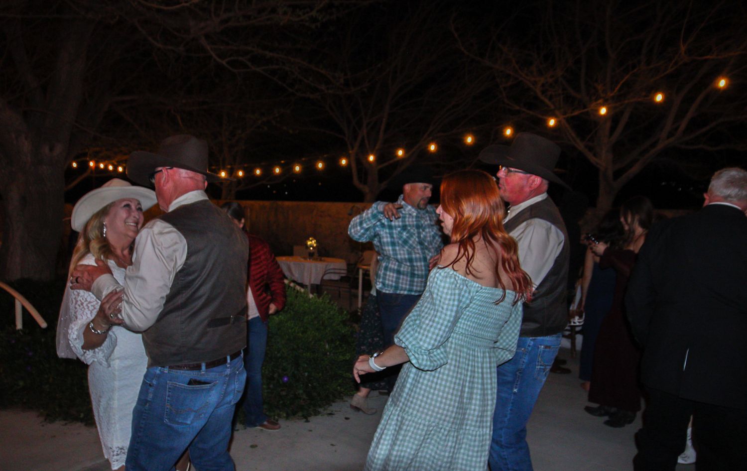 bride and groom dancing with some of the grooms family
Kern County Photography
Tori Marie Photos
California Wedding Photographer