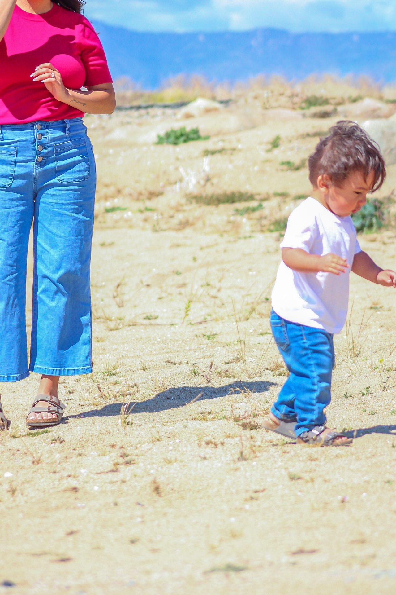 up close artistic photo of mothers torso with son standing near
Kern county photography 
Family photography 
candid family photoshoot