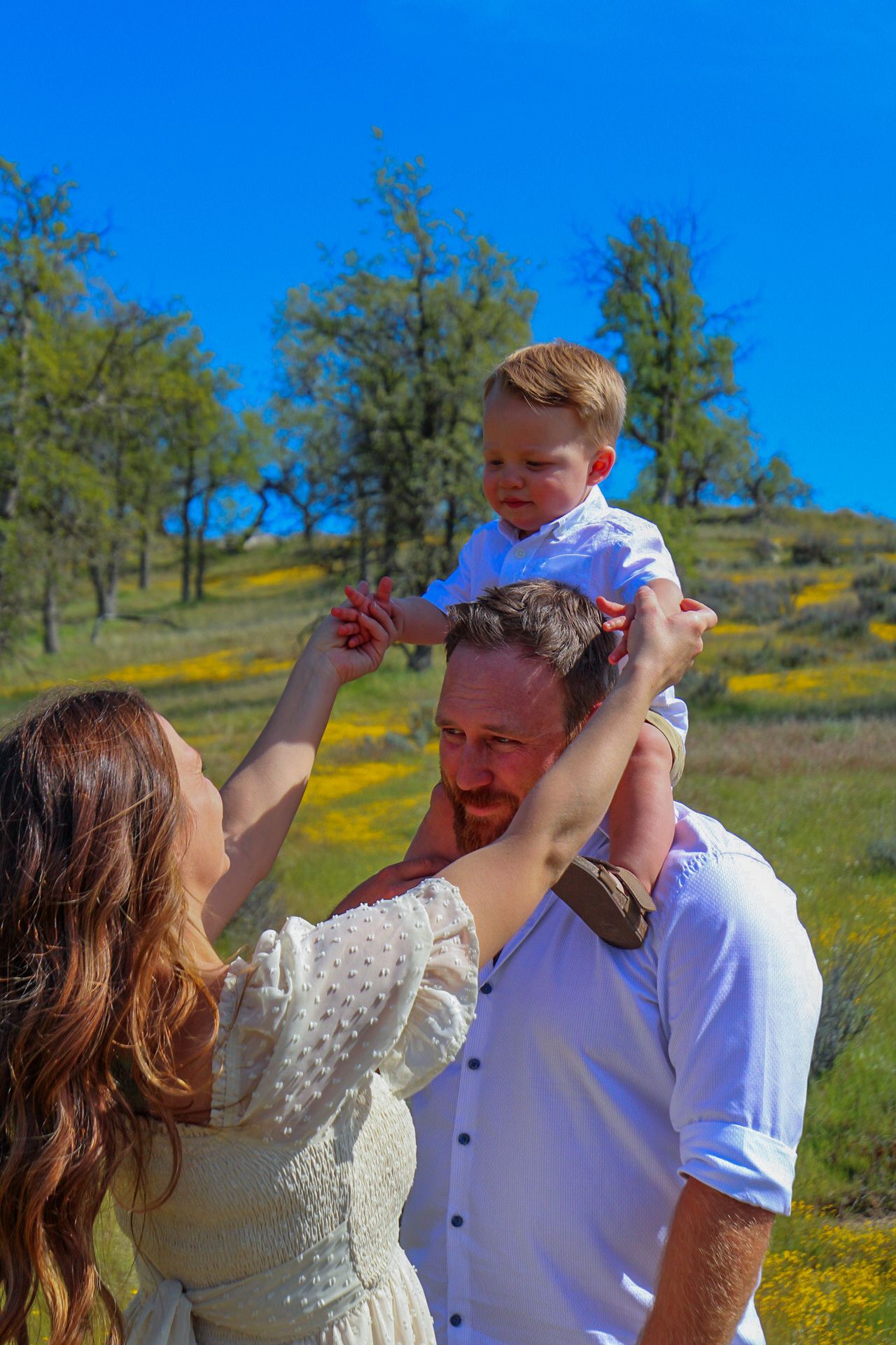 mom playing with baby on dads shoulders
Kern County Photography
Tori Marie Photos
Family Photographer