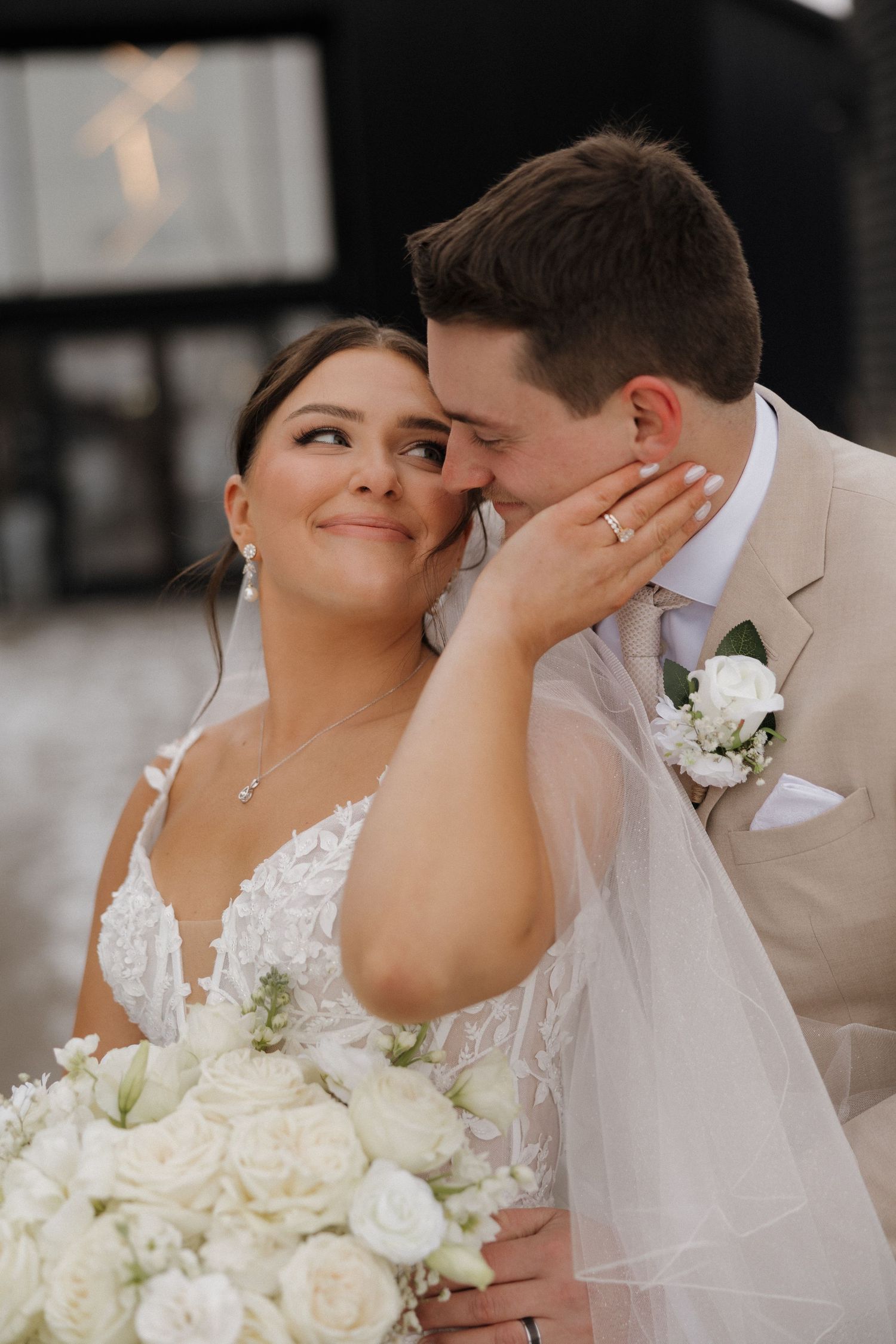 A romantic wedding photo sequence capturing intimate moments between newlyweds with white roses and delicate veil details.