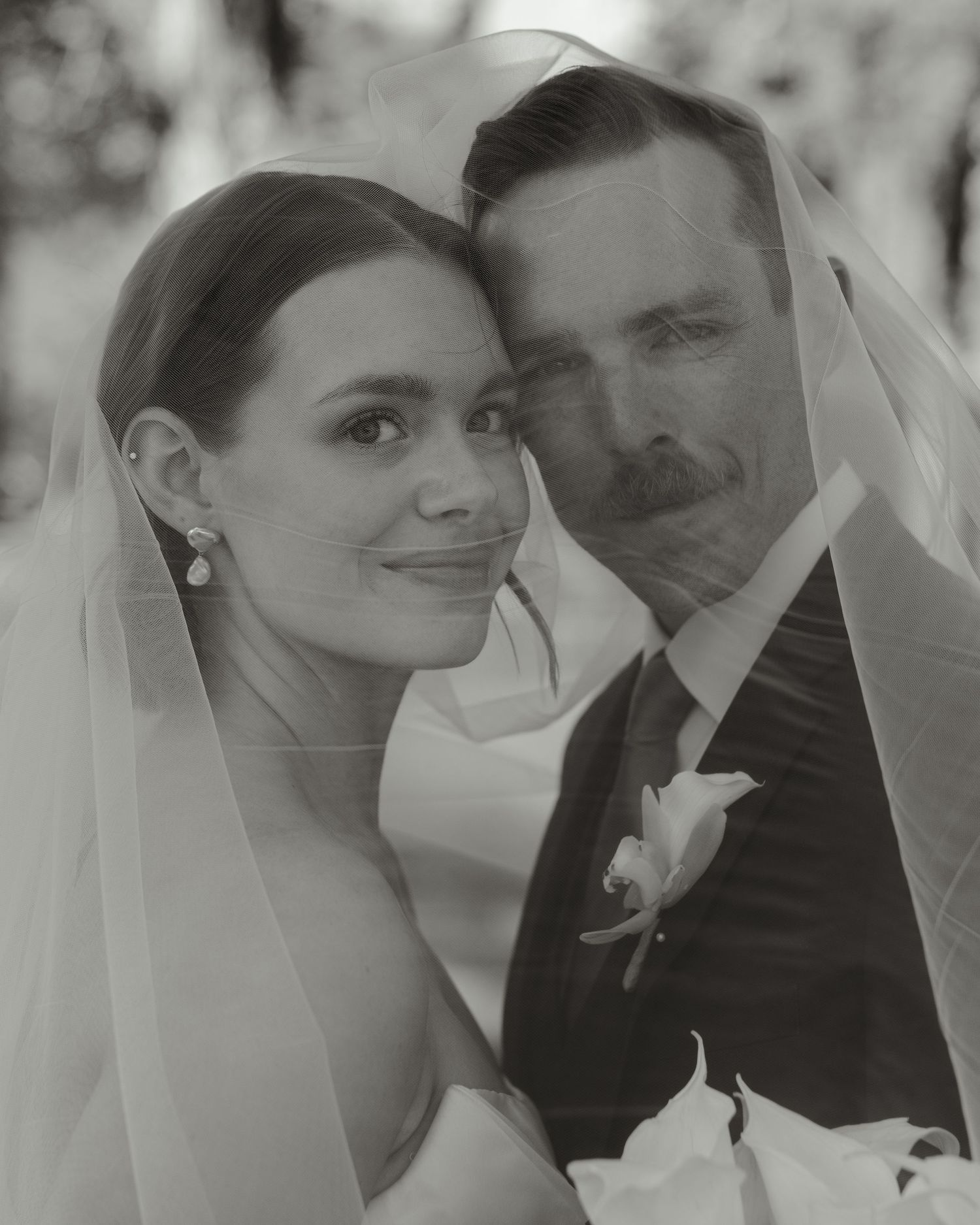 Black and white romantic wedding portraits capturing intimate moments between newlyweds.