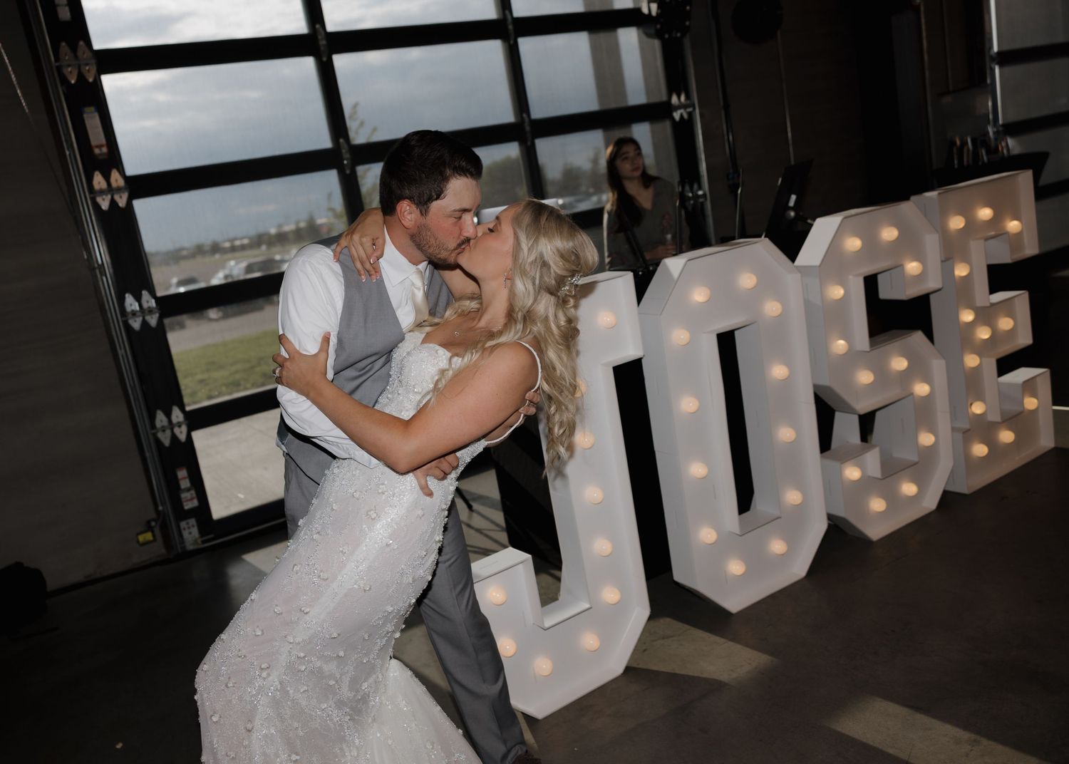 A couple in wedding attire shares a romantic dance together on their special day.