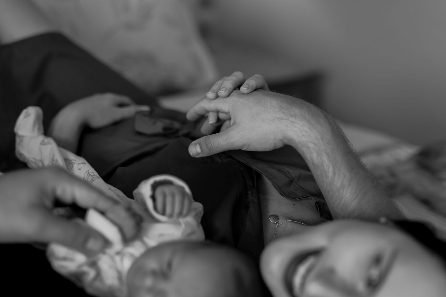 A series of black and white still life photos showing hands holding objects and doing everyday tasks at close range.