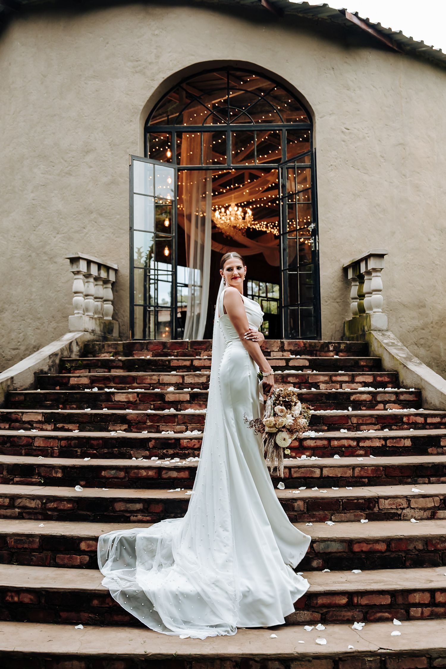 A series of wedding photos showing someone in a flowing white dress ascending rustic stone steps at a romantic venue.