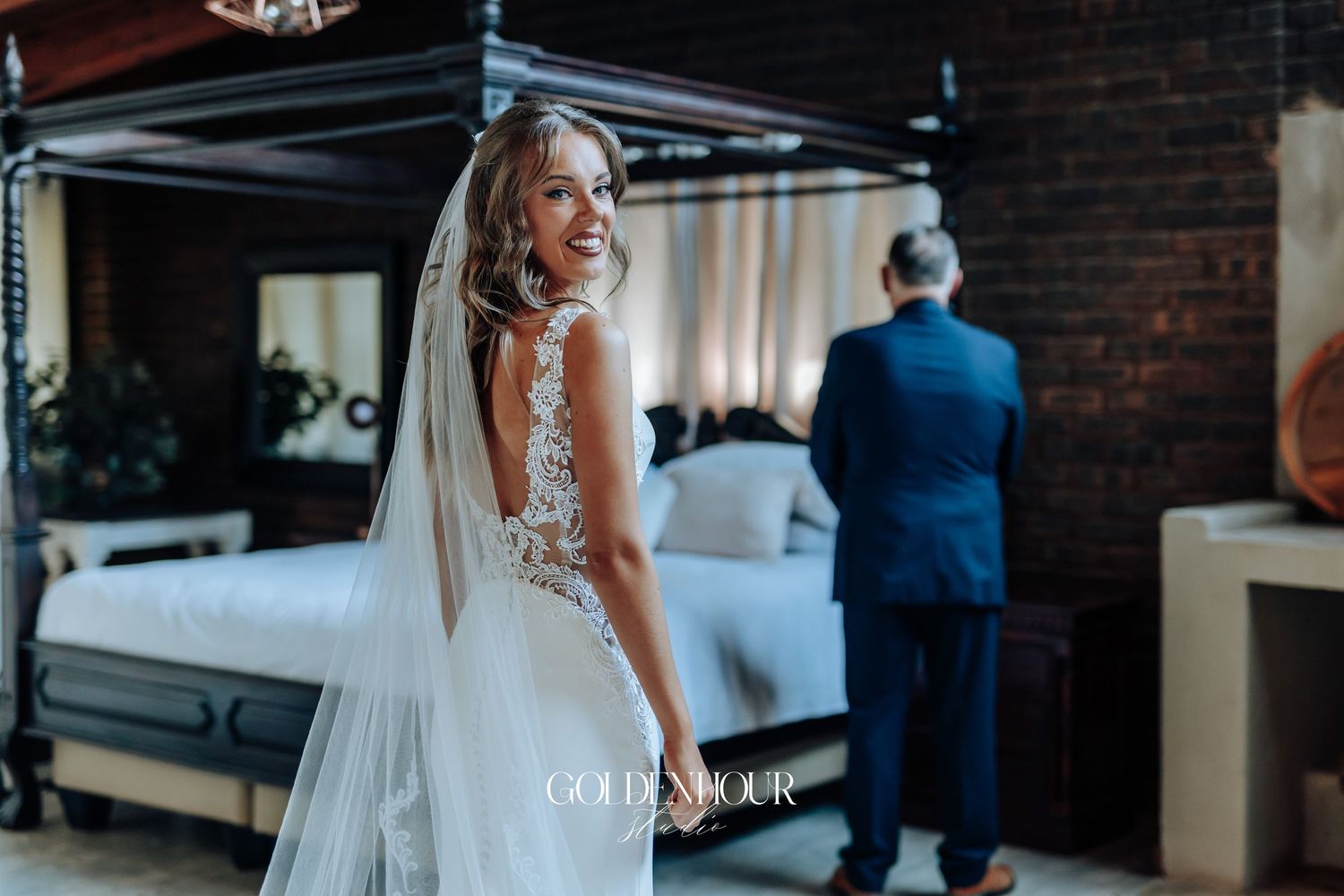 Wedding ceremony scene in an industrial brick venue with elegant decor.
