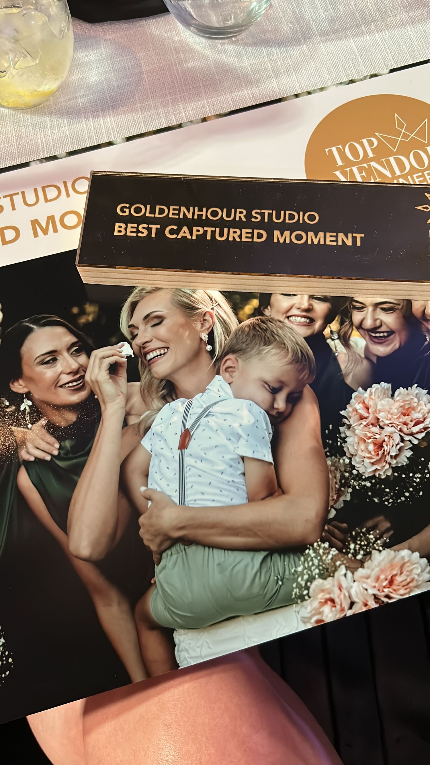 A wedding couple embraces in joy during a romantic dance sequence captured in golden hour lighting.