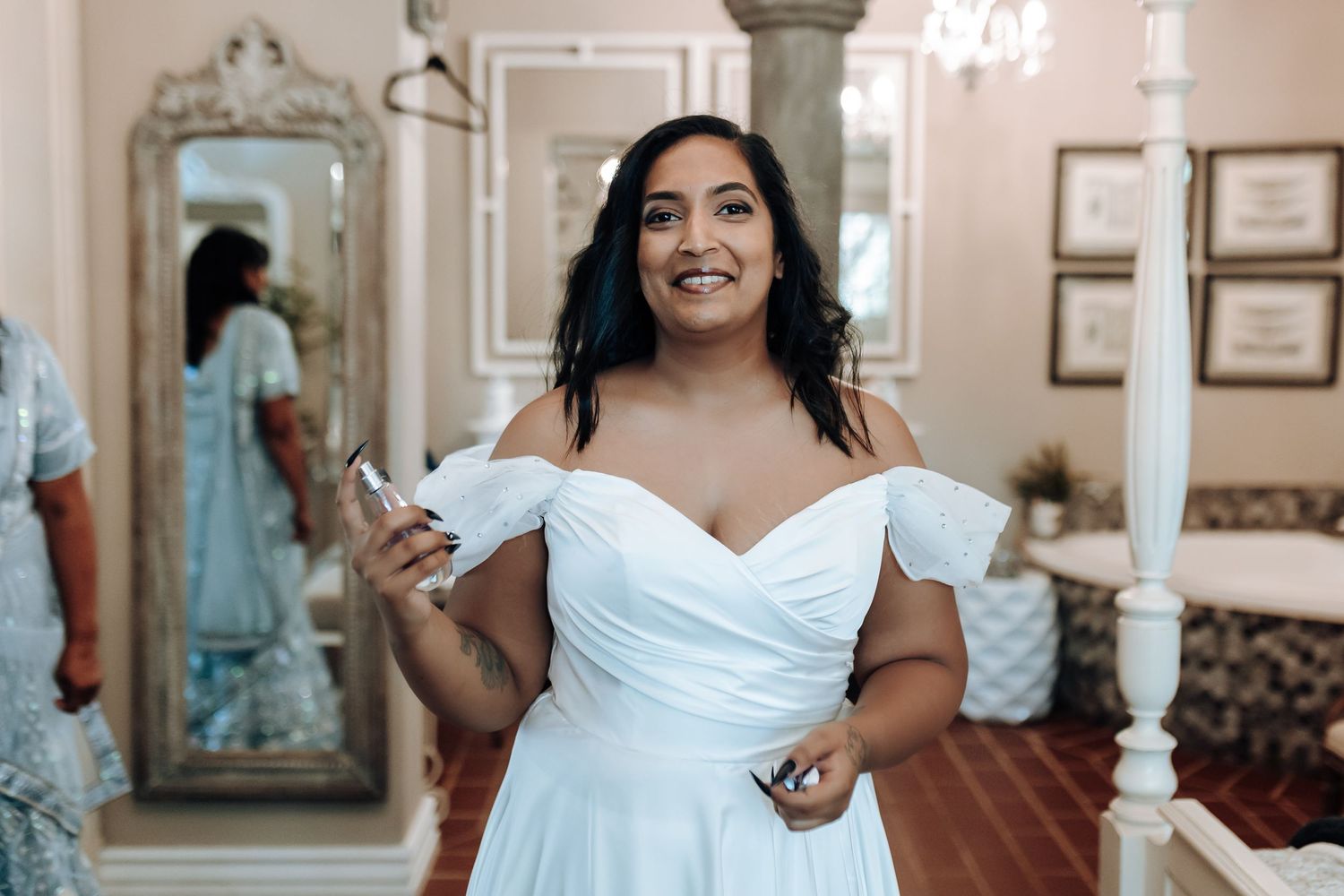 Joyful moment captured in elegant dressing room with ornate mirrors and classical decor.