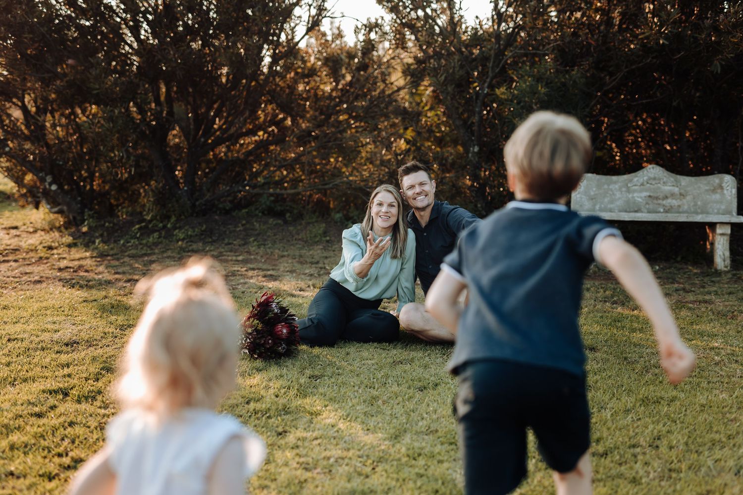 A dynamic sequence of photos showing an energetic toddler running and playing in a backyard during golden hour.