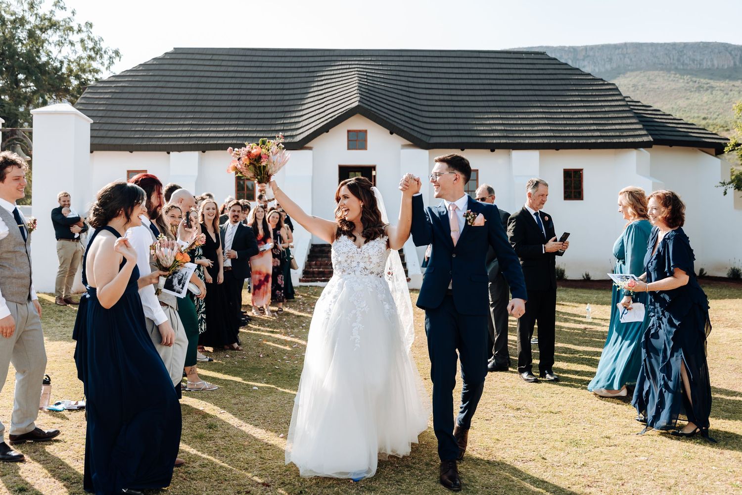 A collage of wedding celebration moments showing guests dancing and socializing outdoors at a rustic venue.