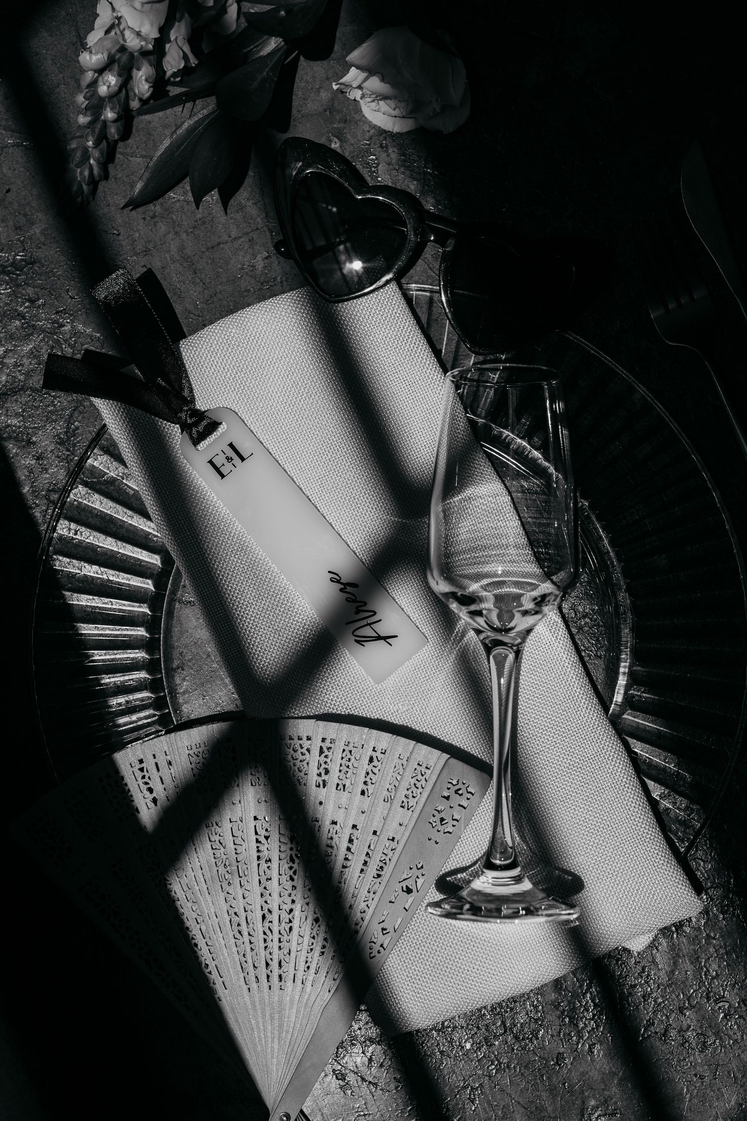 Black and white artistic photos of handwritten papers casting dramatic shadows.