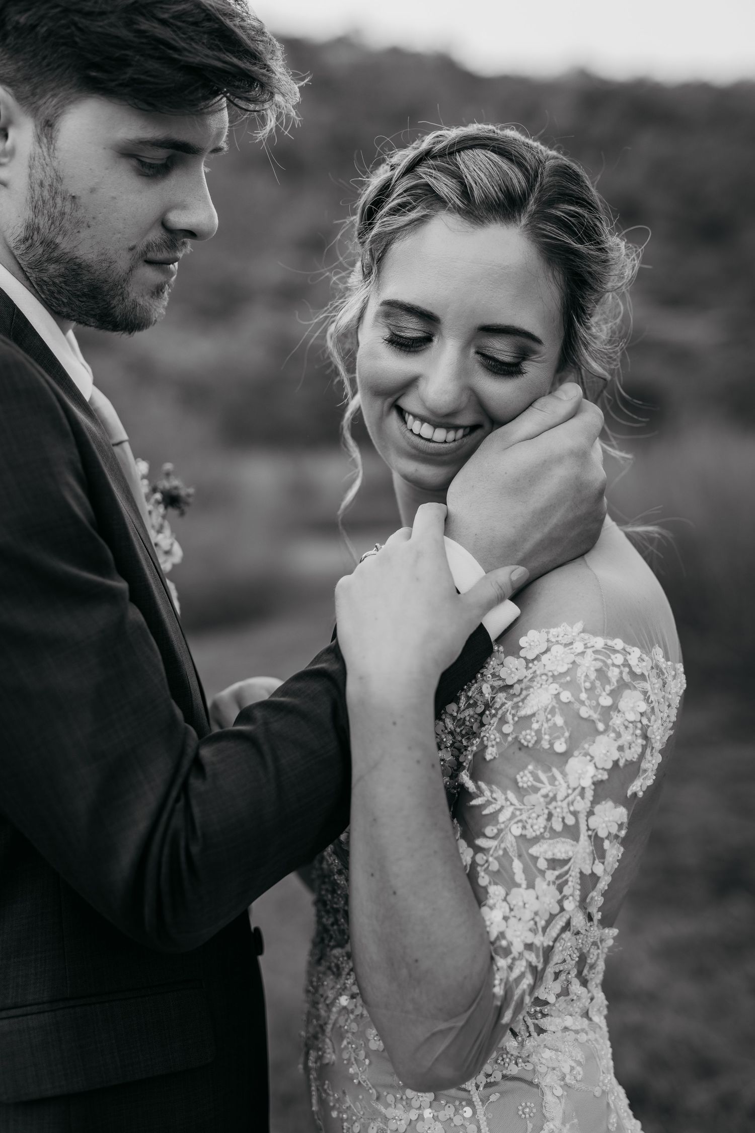 Romantic black and white wedding photos showing intimate moments between newlyweds during outdoor portrait session.