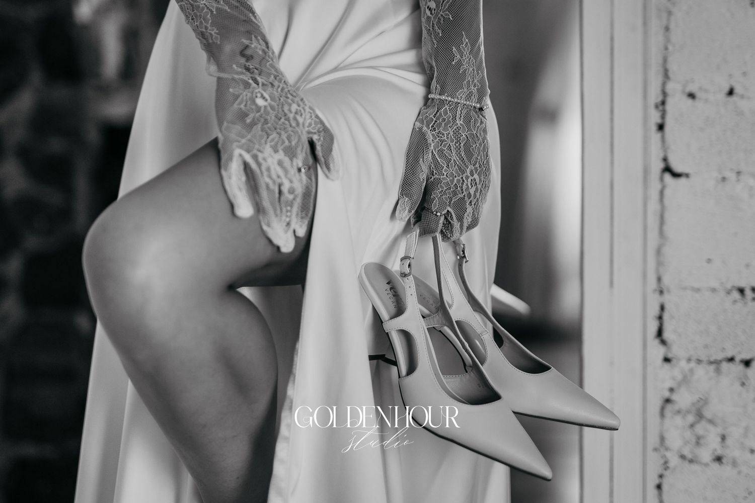 Artistic bridal preparation photos showing details of white lace robes.