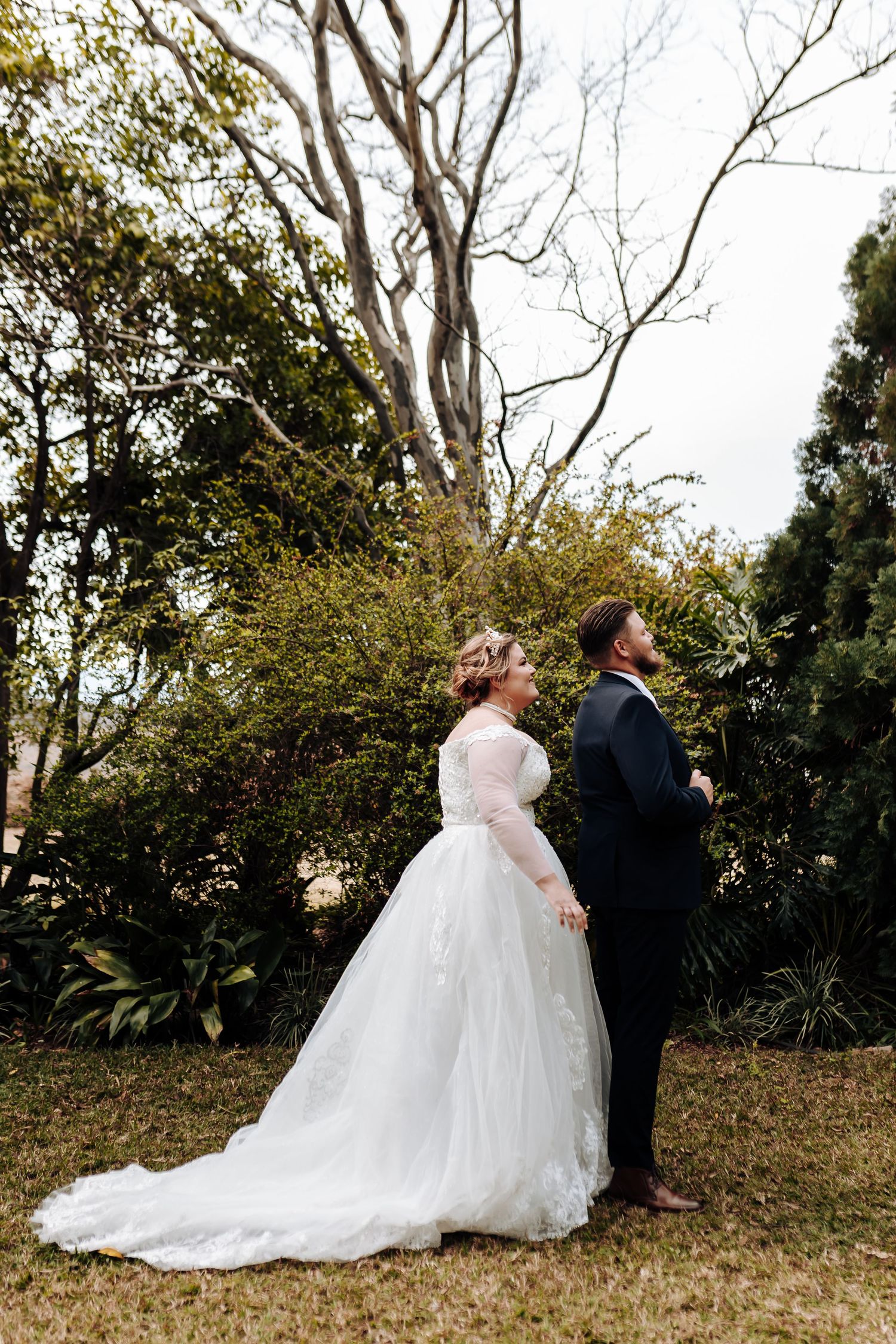A romantic outdoor wedding photoshoot sequence showing the couple in formal attire against a natural backdrop.