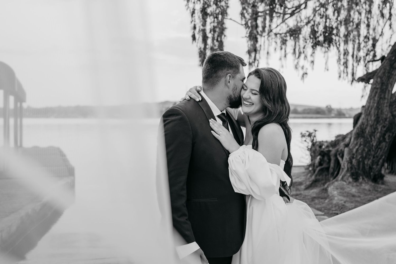 Romantic black and white wedding photo collage showing intimate moments between couples in outdoor settings.