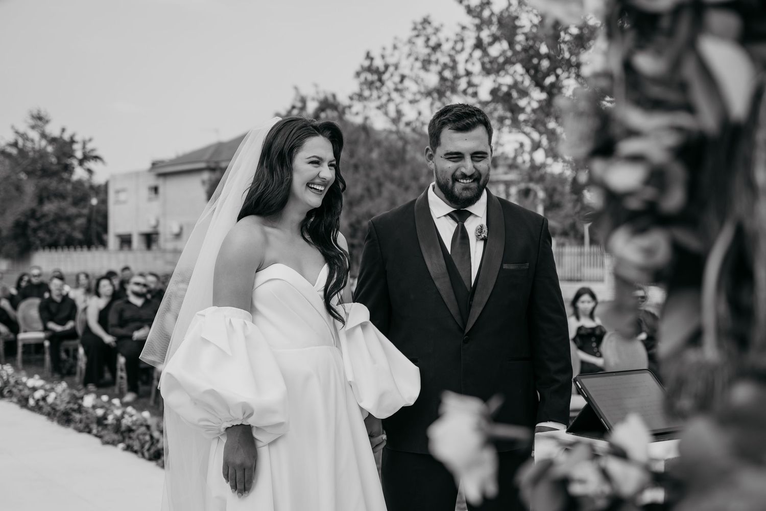 Black and white photo series showing emotional moments from a wedding ceremony and celebration.