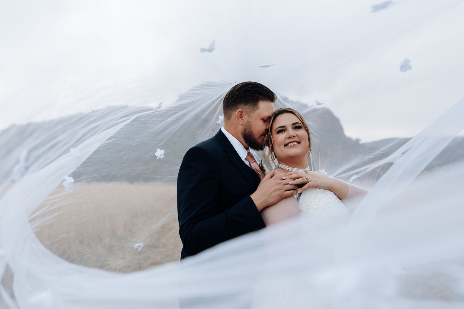 Three tender wedding moments showing embraces and intimate poses against a bright background.