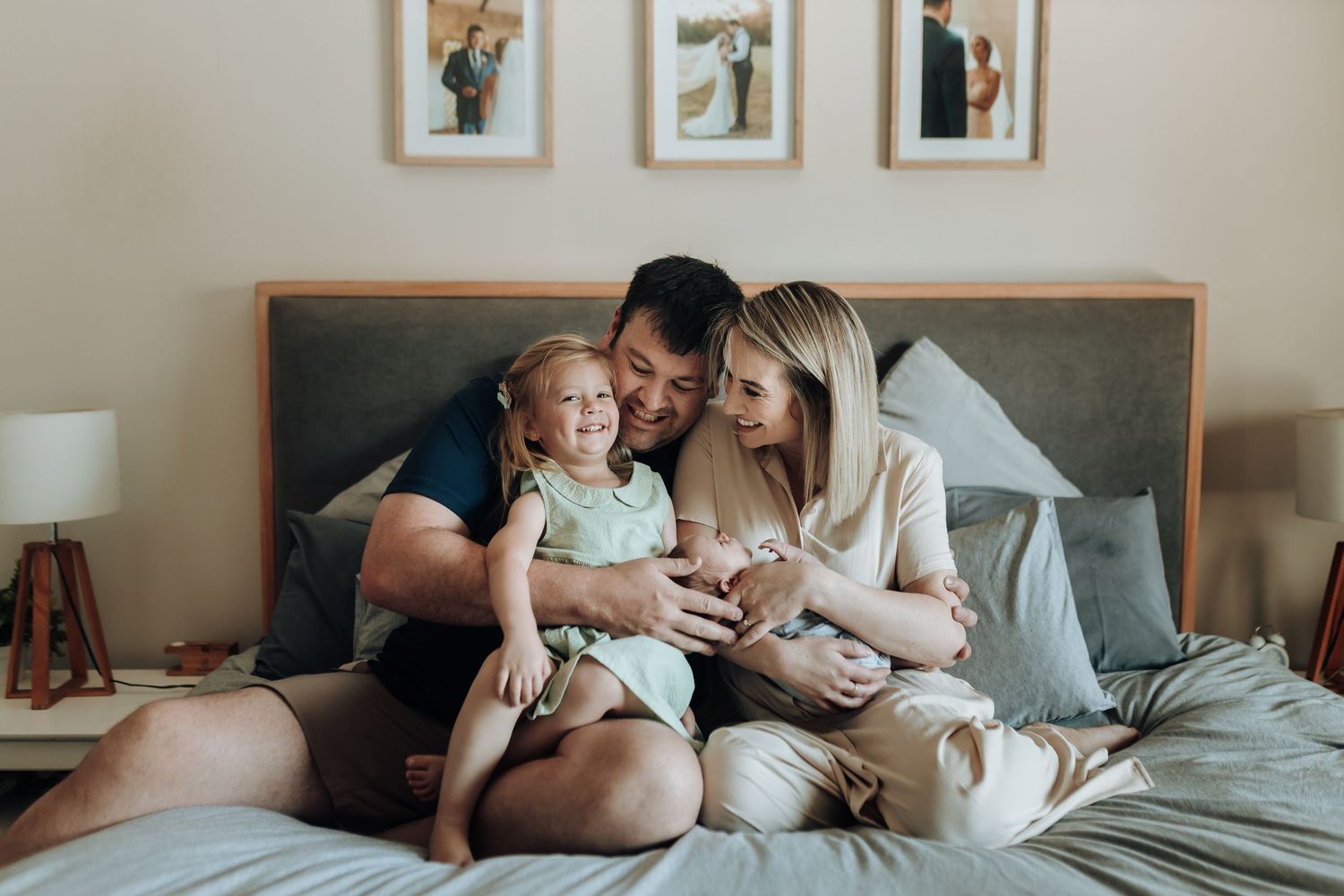 Intimate family moments captured in a series of five connected photographs showing tenderness and connection on a bed.