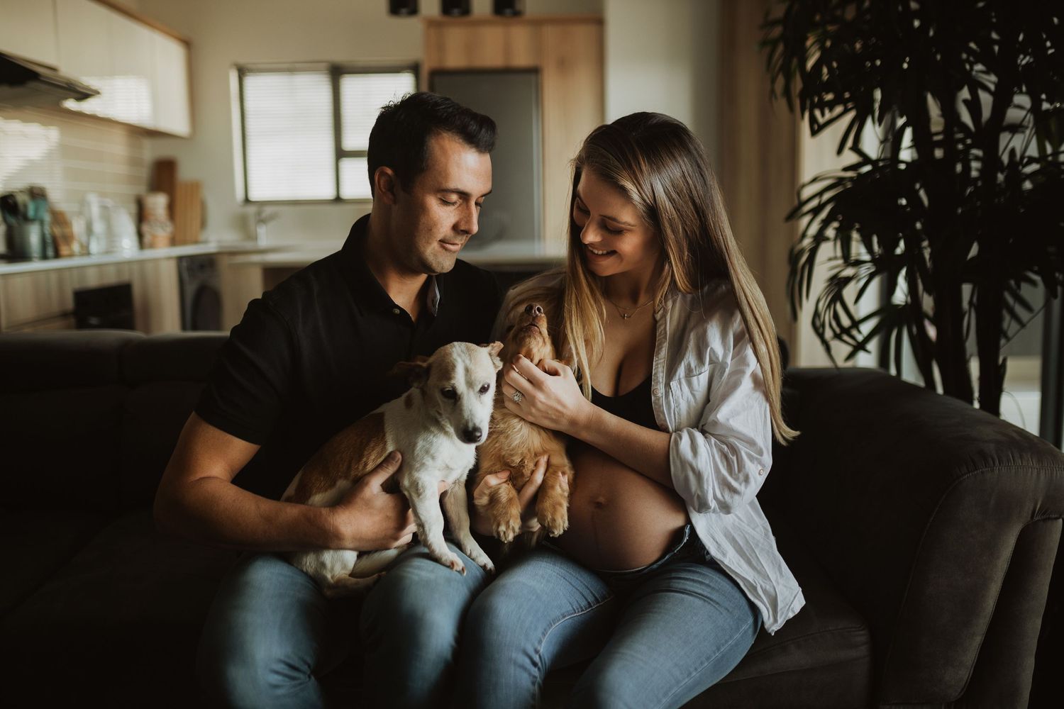 Collection of warm intimate moments between couple on dark couch showing pregnancy and connection.
